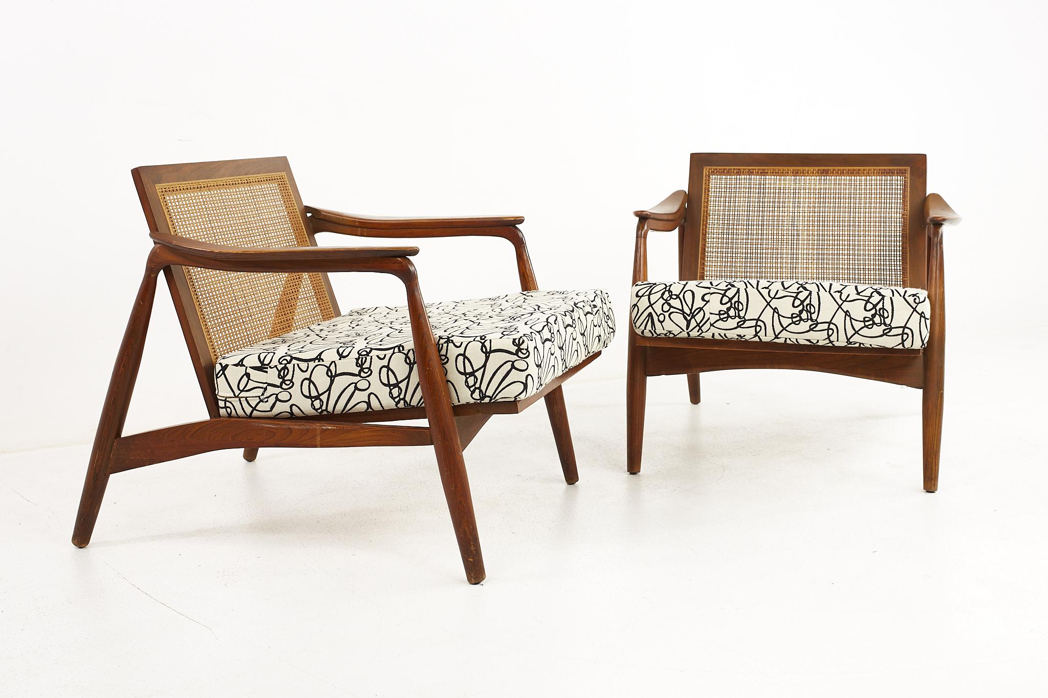 Lawrence Peabody mid century walnut and cane lounge chairs - a pair 

Each chair measures: 29.75 wide x 35 deep x 27.5 high, with a seat height of 16 and arm height of 22.25 inches

All pieces of furniture can be had in what we call restored