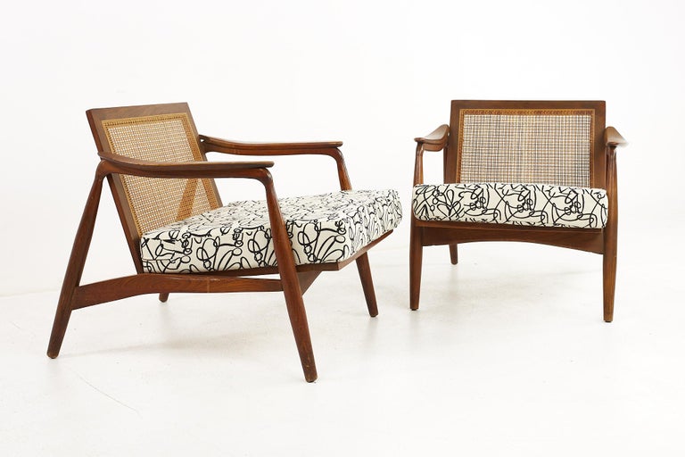 Lawrence Peabody mid century walnut and cane lounge chairs - a pair 

Each chair measures: 29.75 wide x 35 deep x 27.5 high, with a seat height of 16 and arm height of 22.25 inches

All pieces of furniture can be had in what we call restored