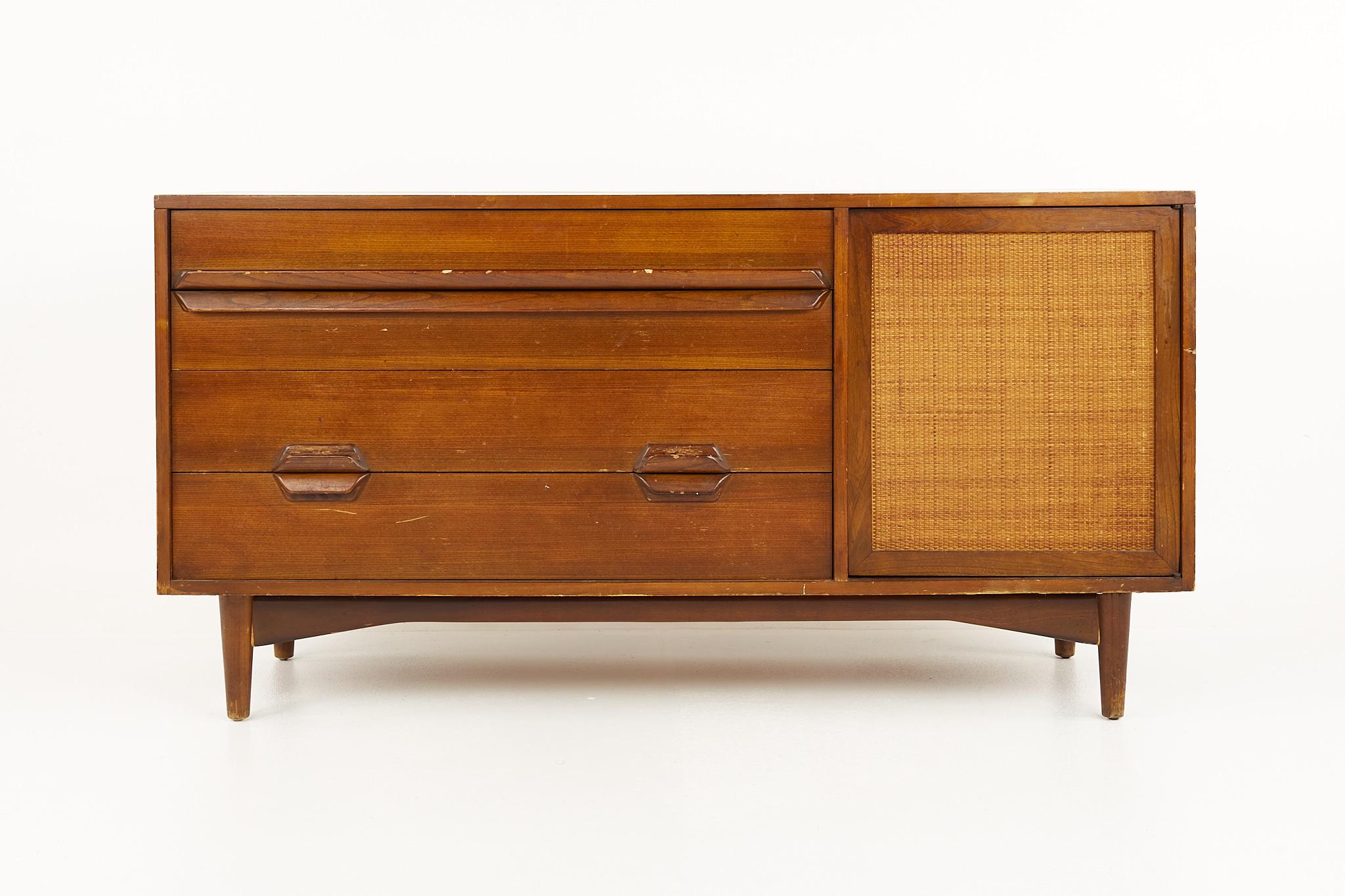Lawrence Peabody mid century walnut and cane sideboard credenza

This credenza measures: 58 wide x 19 deep x 30 inches high

All pieces of furniture can be had in what we call restored vintage condition. That means the piece is restored upon