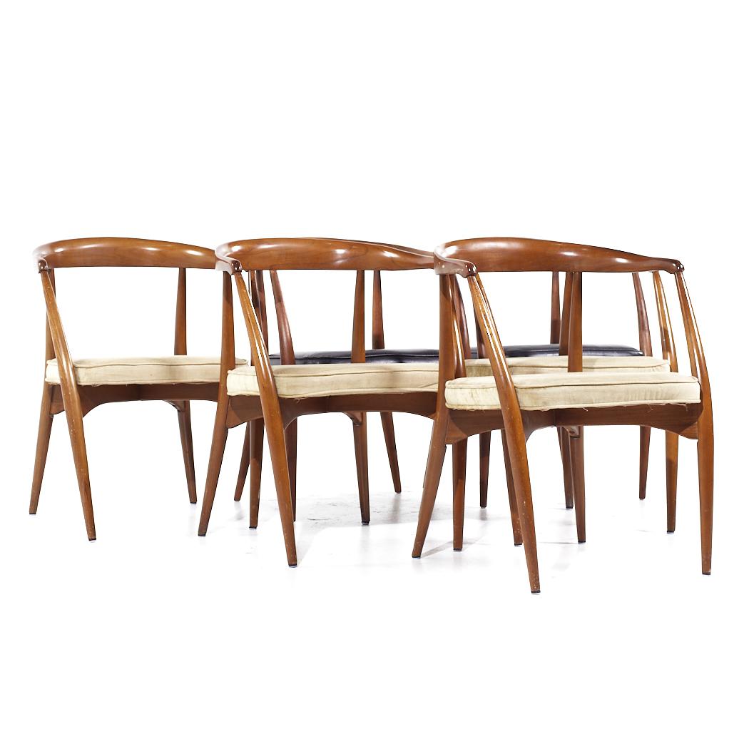 Lawrence Peabody Mid Century Walnut Arm Chairs - Set of 6

Each chair measures: 23.25 wide x 21 deep x 29.75 inches high, with a seat height of 17.5 and arm height/chair clearance of 27.25 inches

All pieces of furniture can be had in what we call