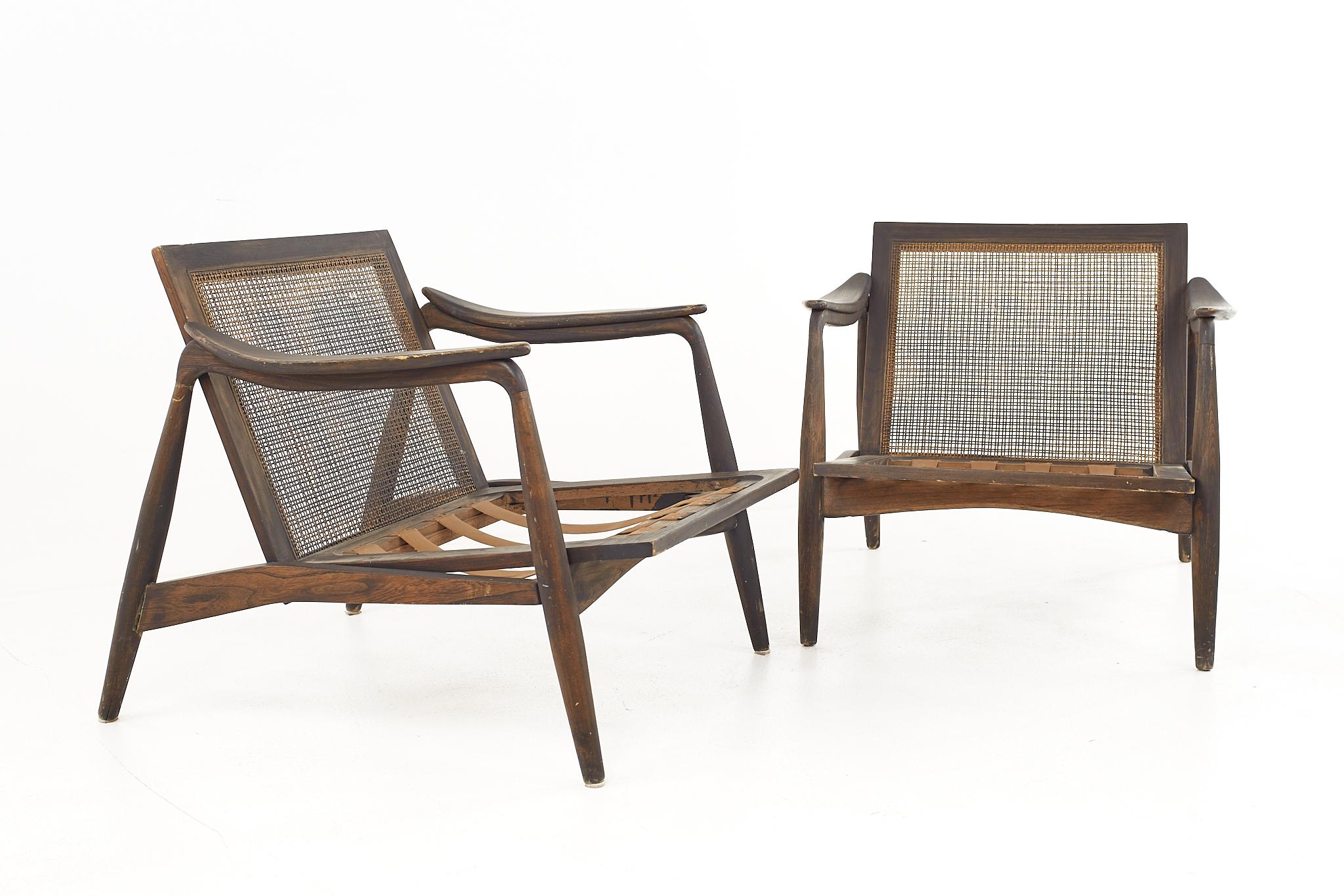 Lawrence Peabody for Richardson Nemschoff Mid Century Ebonized Walnut and Cane Lounge Chairs - A Pair

Each chair measures: 29.5 wide x 35 deep x 27 high, with a seat height of 17 inches and arm height of 21.5 inches 

All pieces of furniture