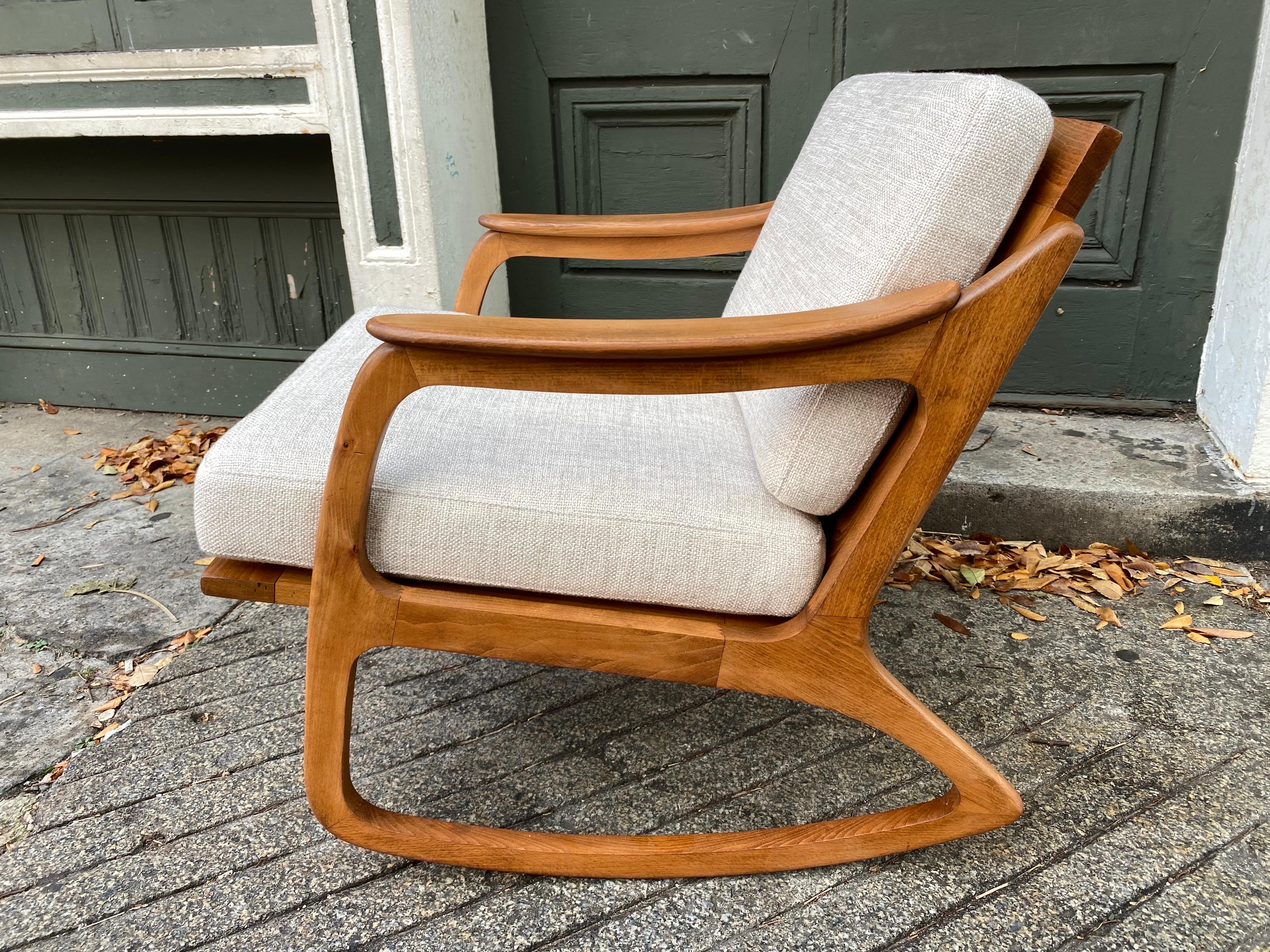 Lawrence Peabody Walnut Rocker.  Danish inspired with a beautiful caned back panel.  New upholstery and wood all refinished with new straps.  Comfortable roomy Rocker with tons of style and personality!