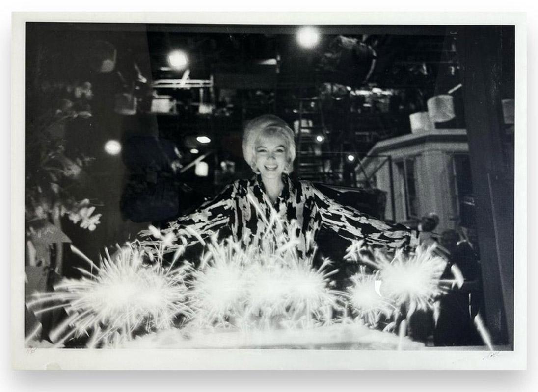 Artist: Lawrence Schiller
Title: Marilyn Monroe Birthday Cake
Year: 1962 (printed 2007)
Medium: Gelatin Silver Print
Signed & numbered in ink.
Edition: 11/35
Size: 42 in. x 60 in.
Condition: Some minor blemishes on acrylic, otherwise in very good