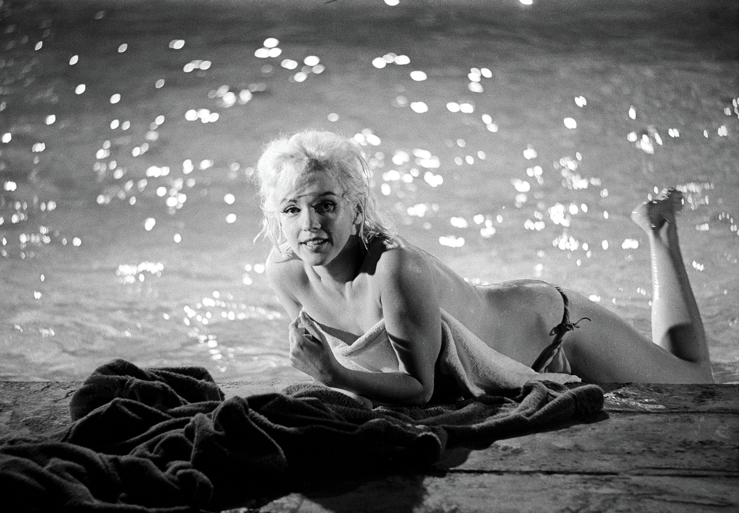 Marilyn Monroe Lying Poolside by Lawrence Schiller, 21/75