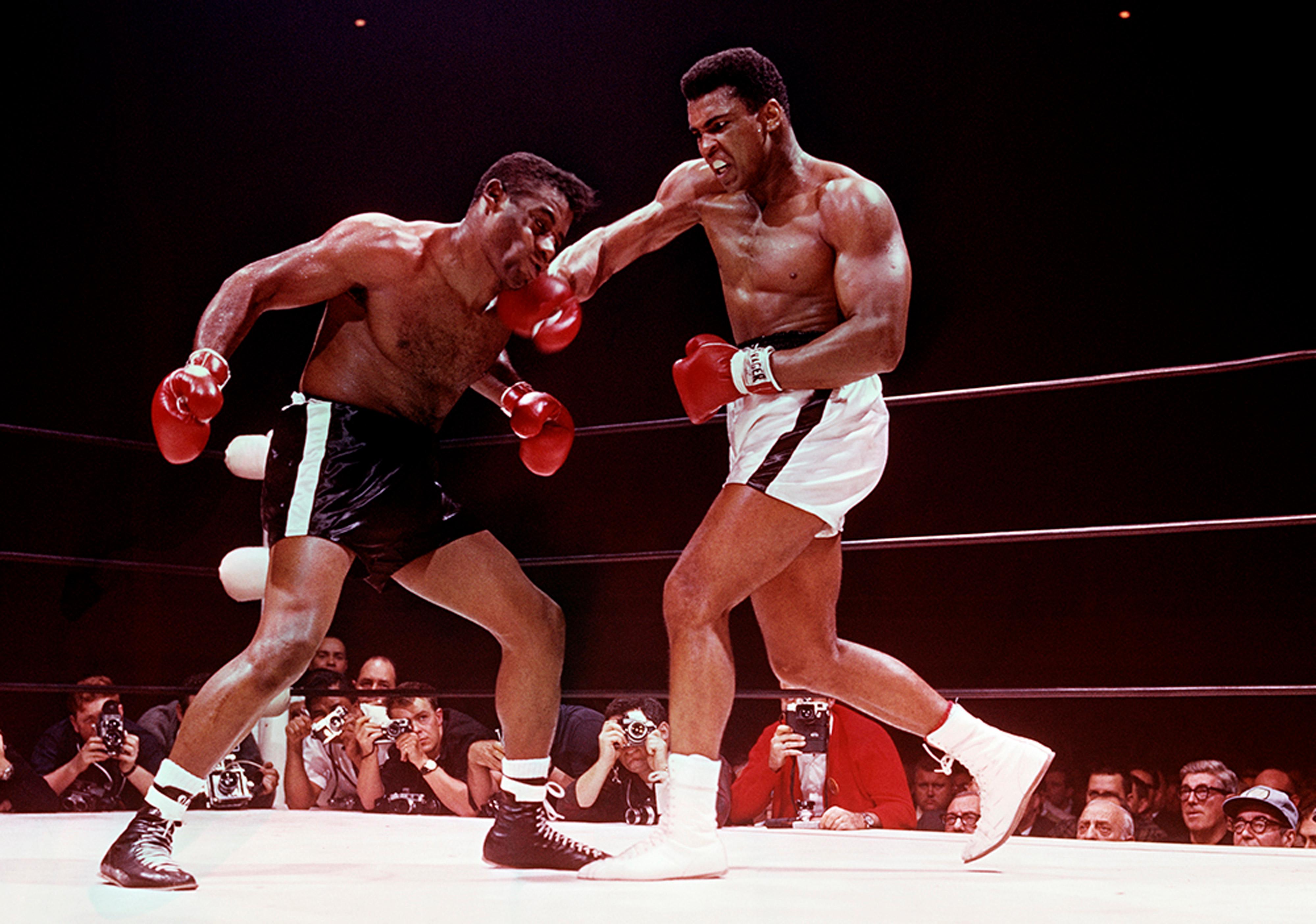 Lawrence Schiller Color Photograph - Muhammad Ali defeating Floyd Patterson, Las Vegas, November 1965