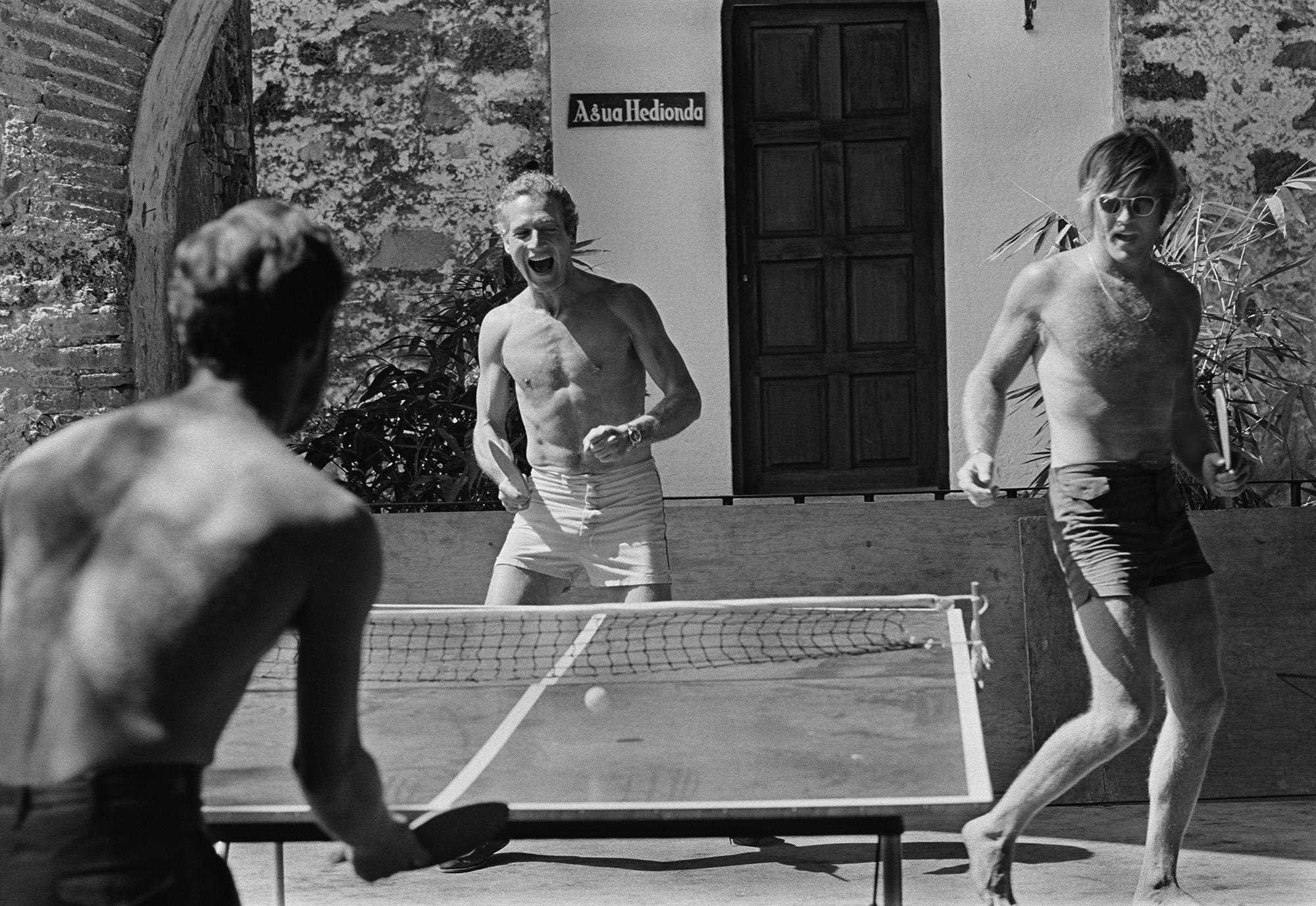 Lawrence Schiller Portrait Photograph - Robert Redford and Paul Newman playing Ping-Pong, printers proof print