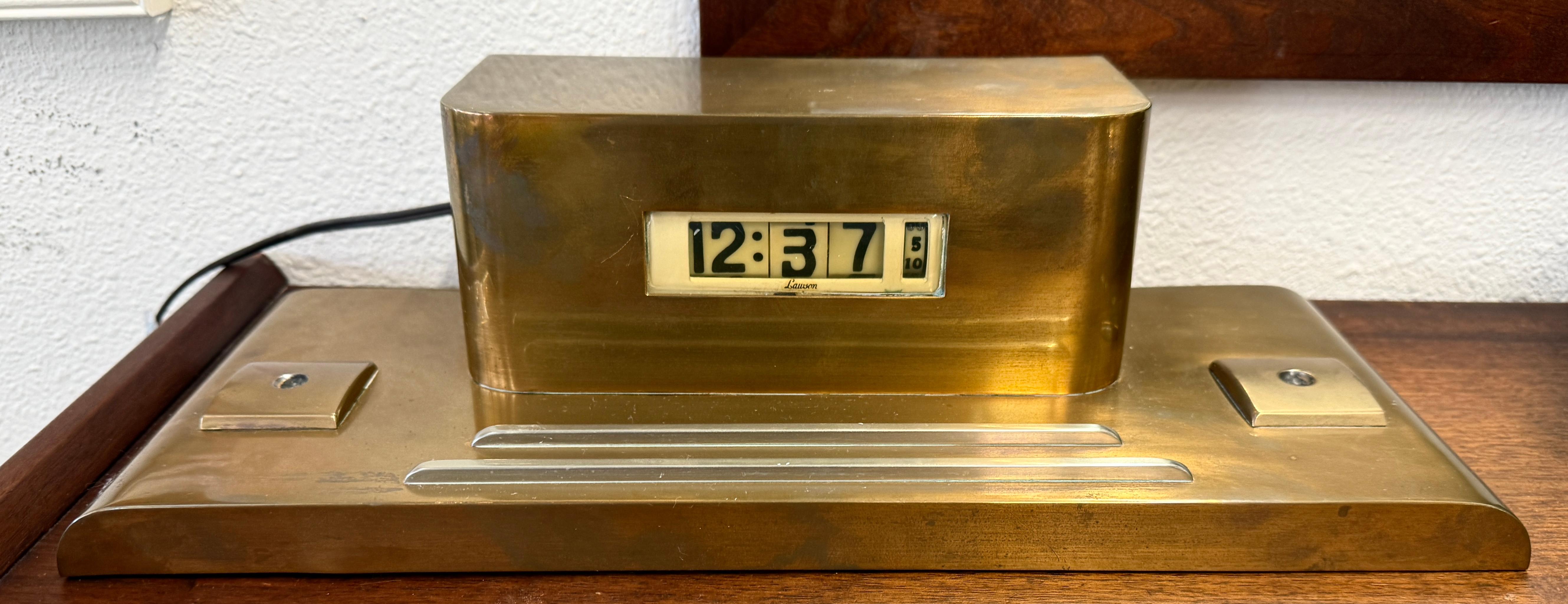 A nice art deco Lawson clock in copper n working order. Nice early digital display with rolling cylinders. The clock has been keeping good time for a few weeks now in our gallery. The copper case has some wear and is in unpolished estate found