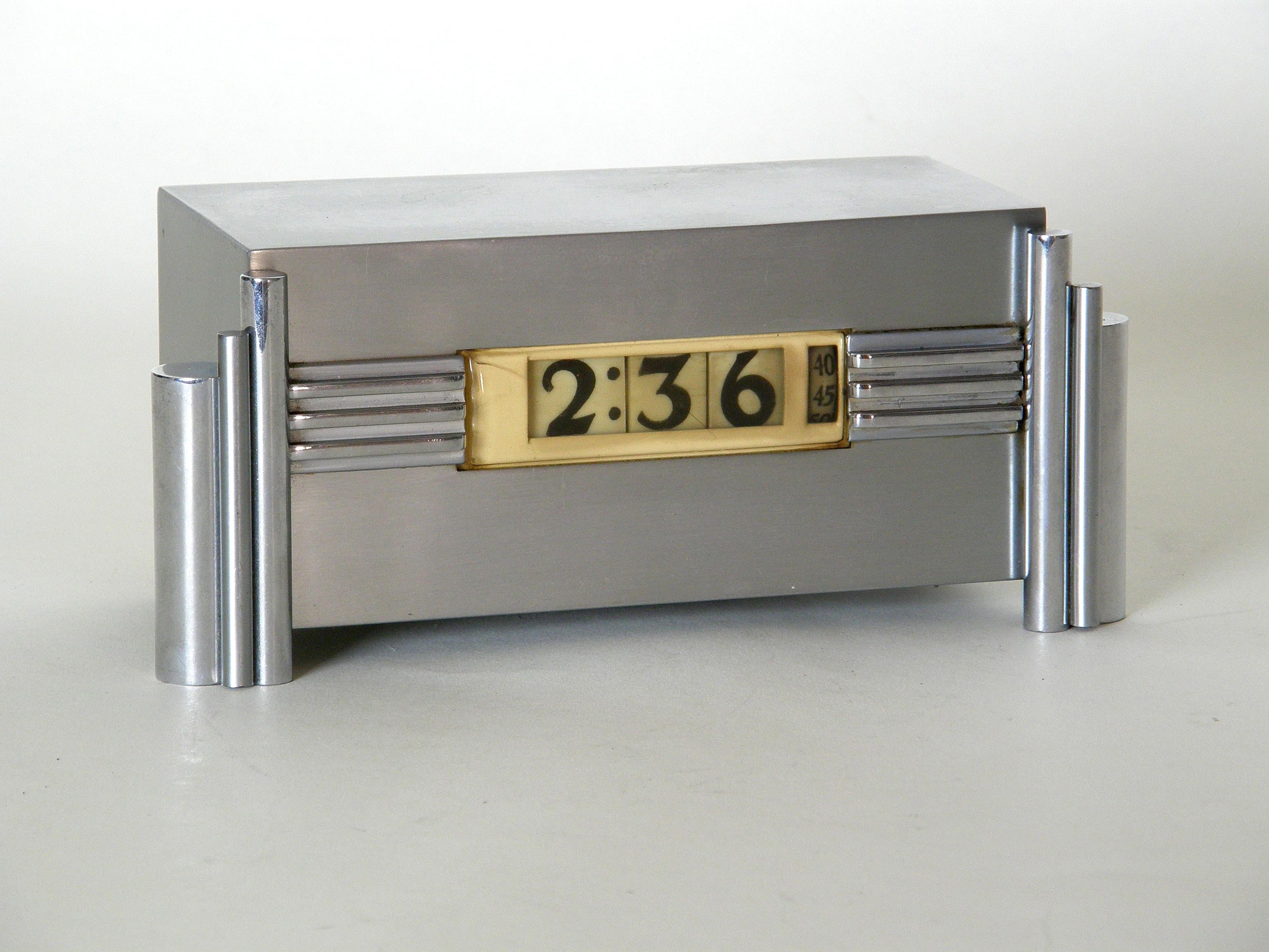 This handsome, digital table clock was made in the 1930s by Lawson Time, a clock manufacturer in Los Angeles, California. It was one of several clocks designed for them in the Art Deco style by Ferher and Adomatis, presumably Paul Feher and George