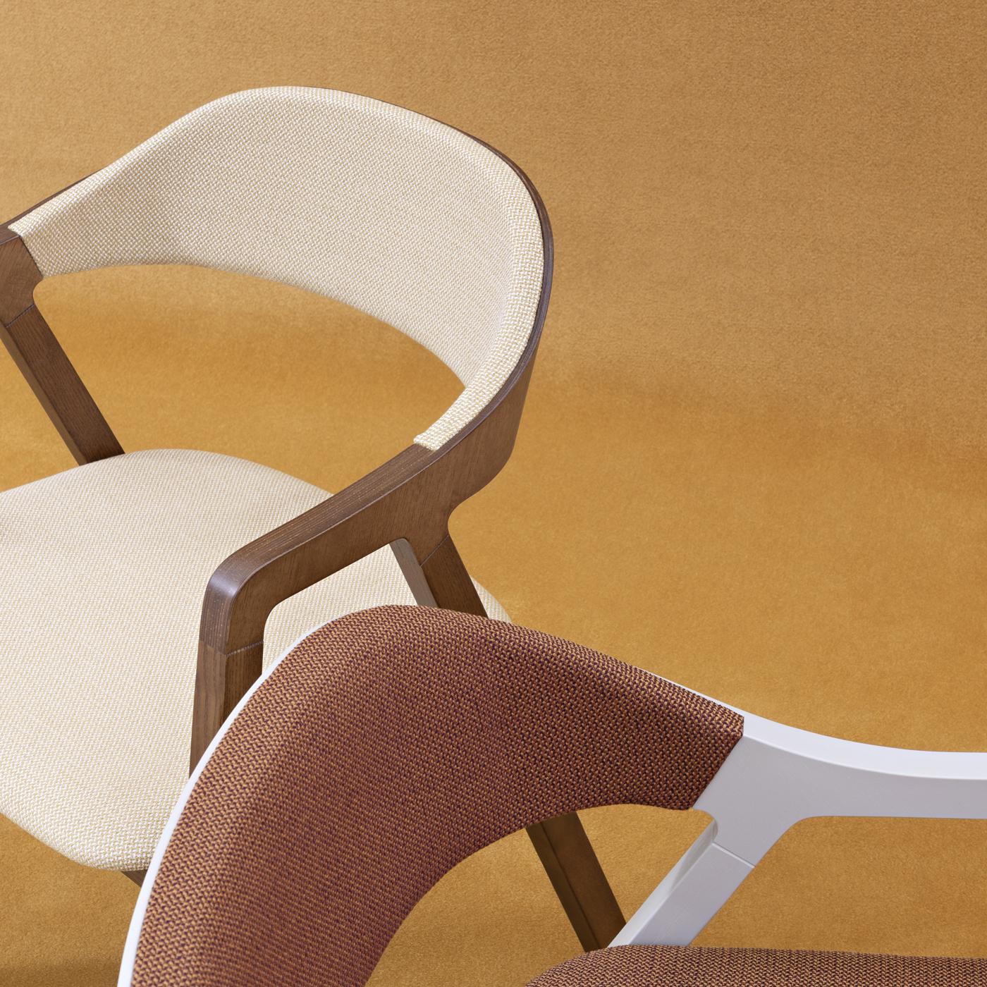 Designed by Michael Geldmacher in 2018, the Layer Chair is characterized by its legs, inspired by an open compass. Featuring smooth transitions between materials and parts, the Layer Chair was designed for fresh, new spaces. A complementary lounge