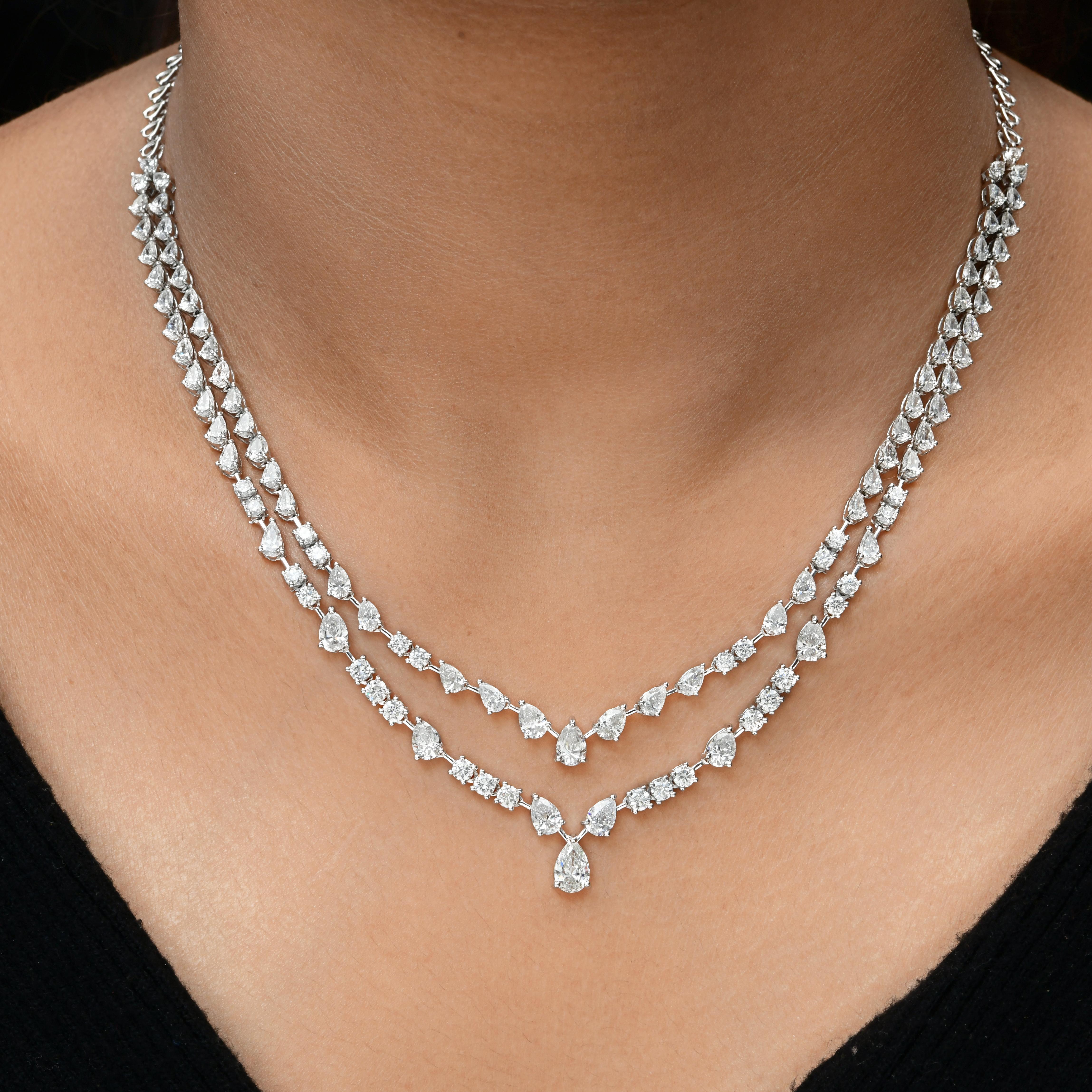Collana a goccia tennis in oro bianco 14k con diamanti a strati da 11,35 carati SI Clarity H Color.
Questa collana presenta una silhouette a cascata a doppio strato, con ogni filo meticolosamente incastonato di pietre brillanti rotonde e a taglio