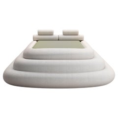 Layered Cake Bed Upholstered in Bouclé Fabric by Koki Design House