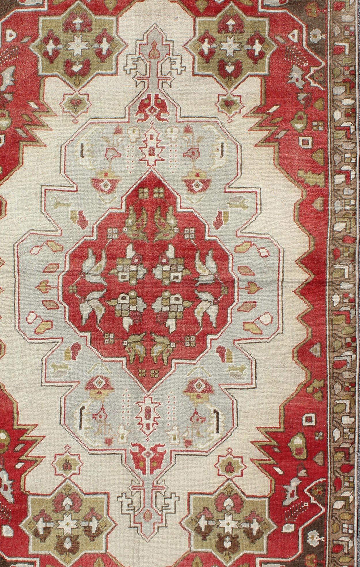 Layered Medallion Vintage Turkish Area Rug Oushak with Geometric Motifs In Good Condition For Sale In Atlanta, GA