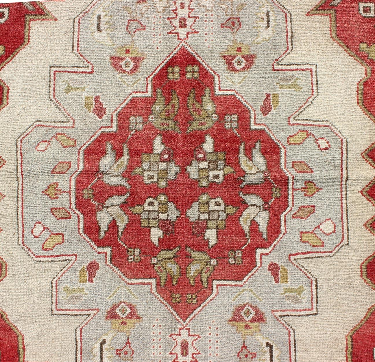 Mid-20th Century Layered Medallion Vintage Turkish Area Rug Oushak with Geometric Motifs For Sale