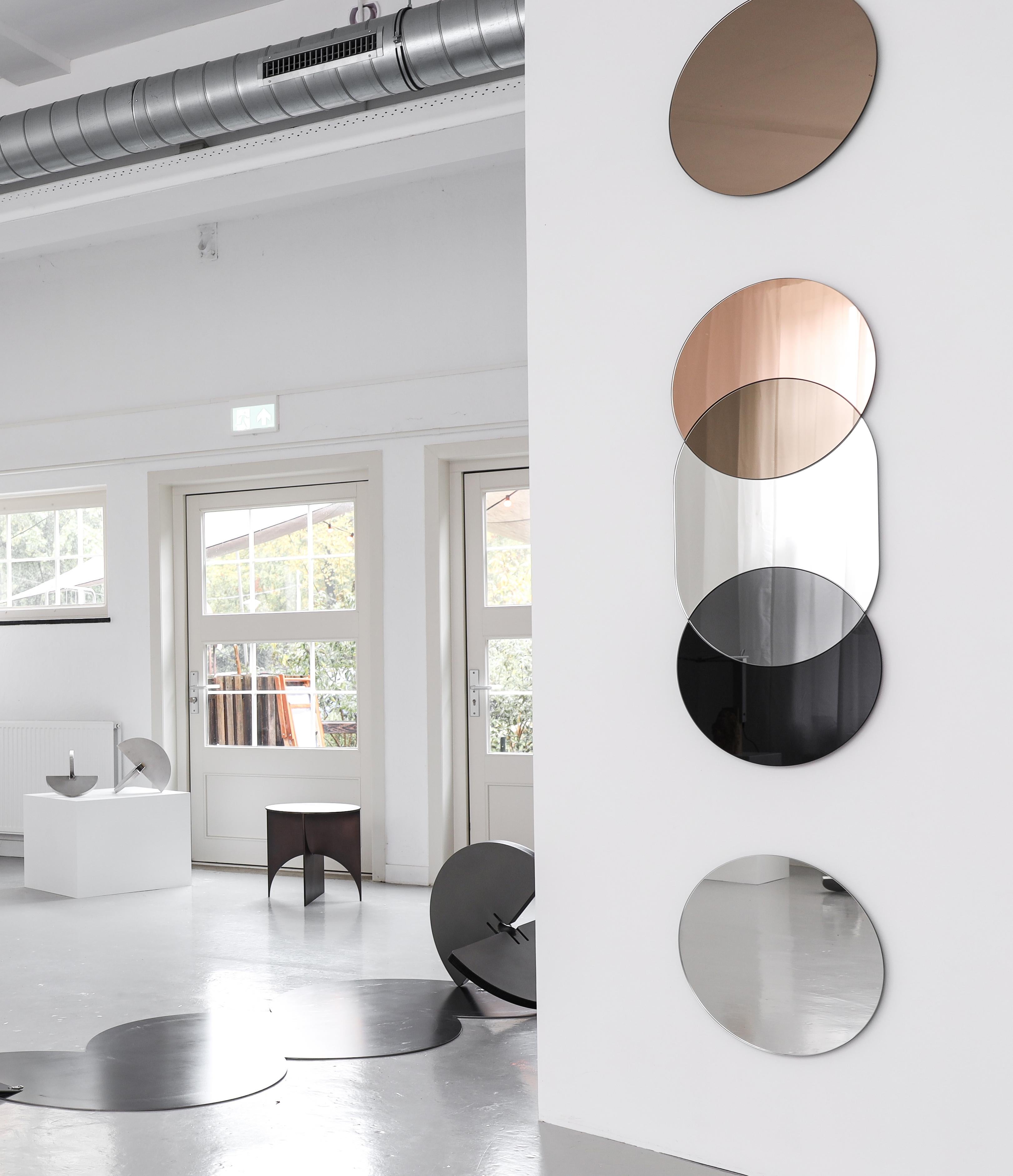 The Layered Silhouettes mirrors are playful reflective compositions that blend functional mirrors with geometric decorative wall objects. The Layered Silhouettes mirrors create the illusion of space and transparency, using chromatic mirrors in