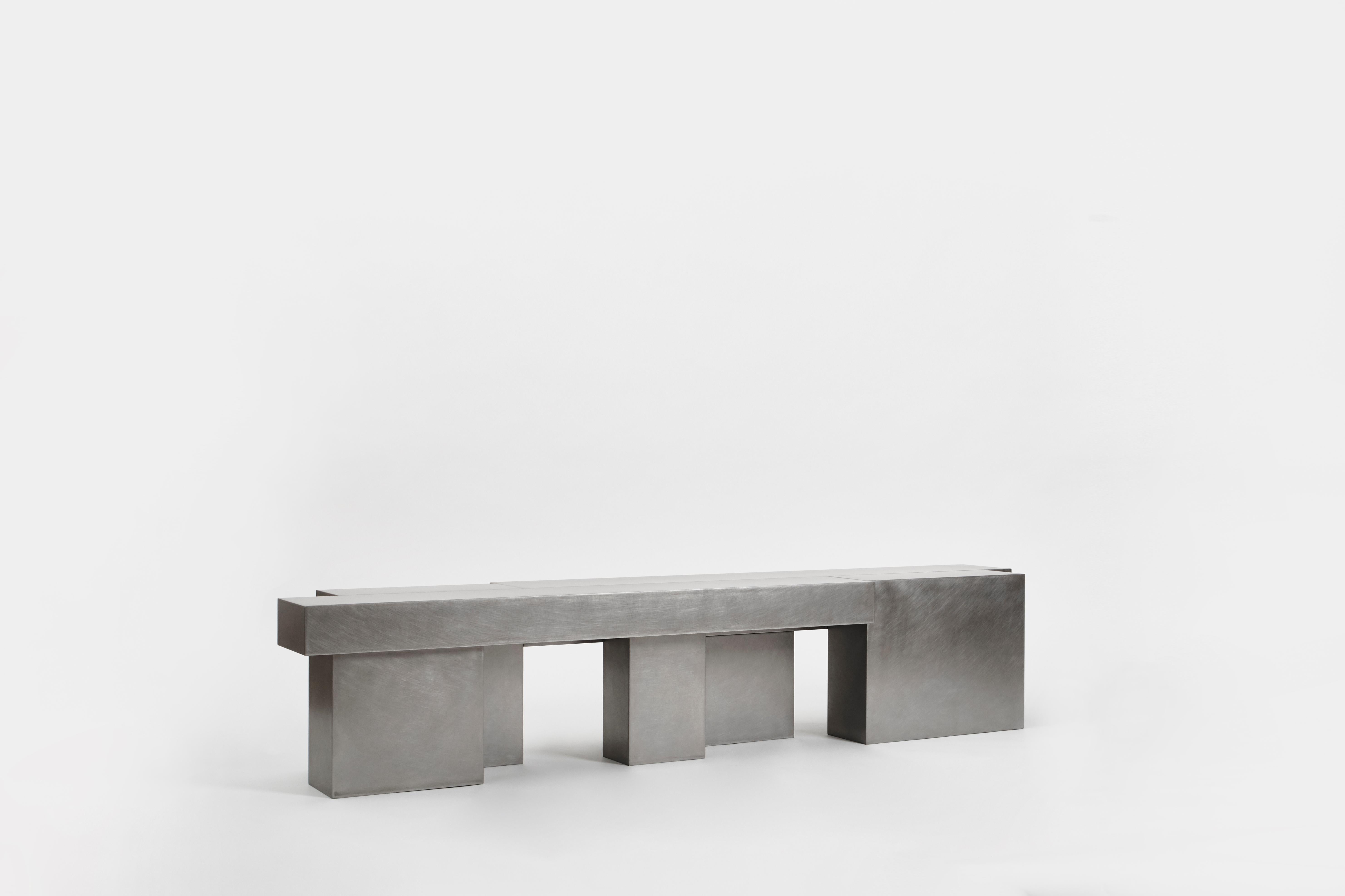 Layered steel bench by Hyungshin Hwang
Dimensions: D 36 x W 180 x H 36 cm
Materials: Stainless Steel

Layered Series is the main theme and concept of work of Hwang, who continues his experiment which is based on architectural composition of