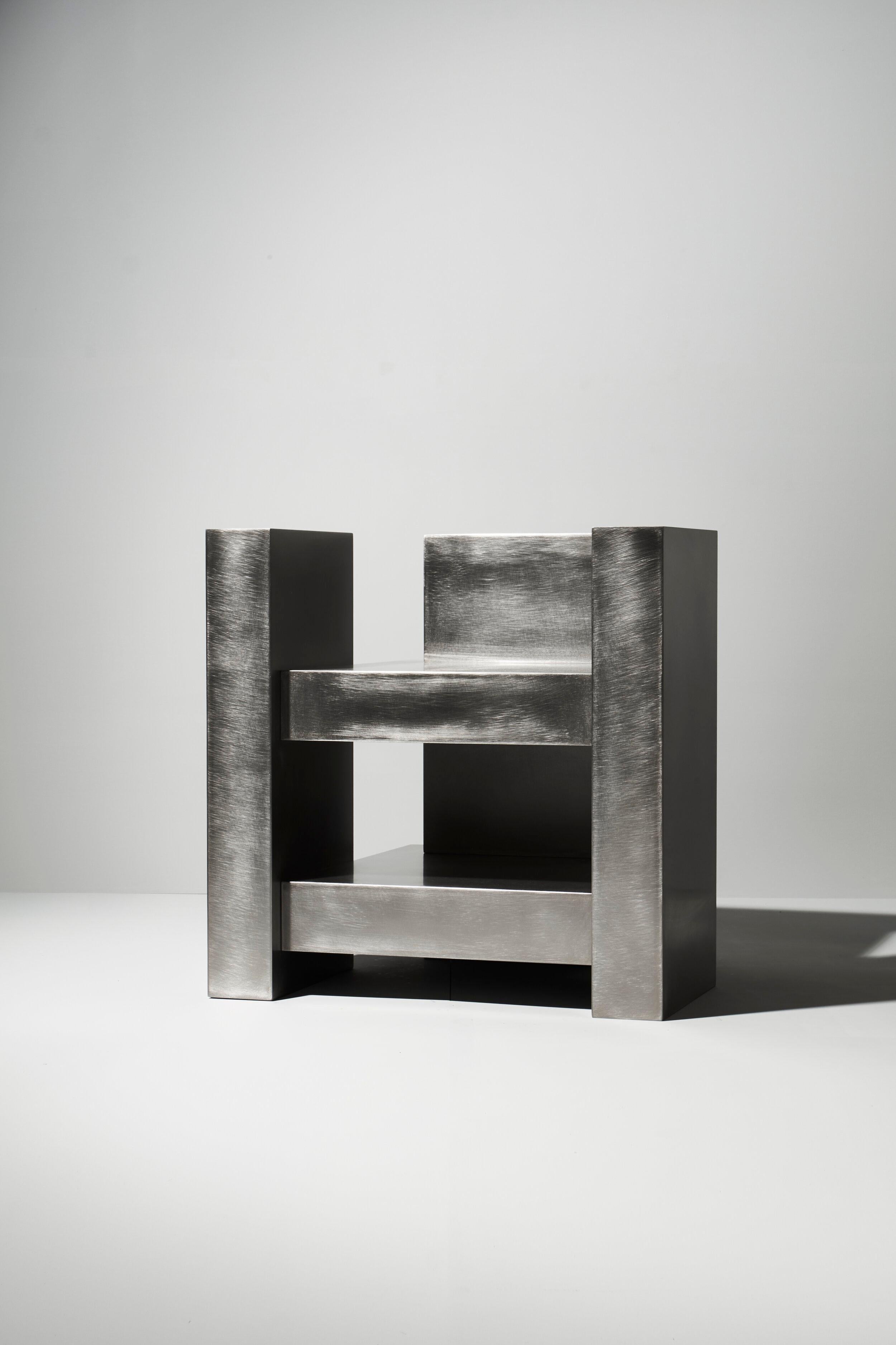 Layered steel seat by Hyungshin Hwang
Dimensions: D 60 x W 54 x H 60 cm
Materials: stainless steel

Layered Series is the main theme and concept of work of Hwang, who continues his experiment which is based on architectural composition of