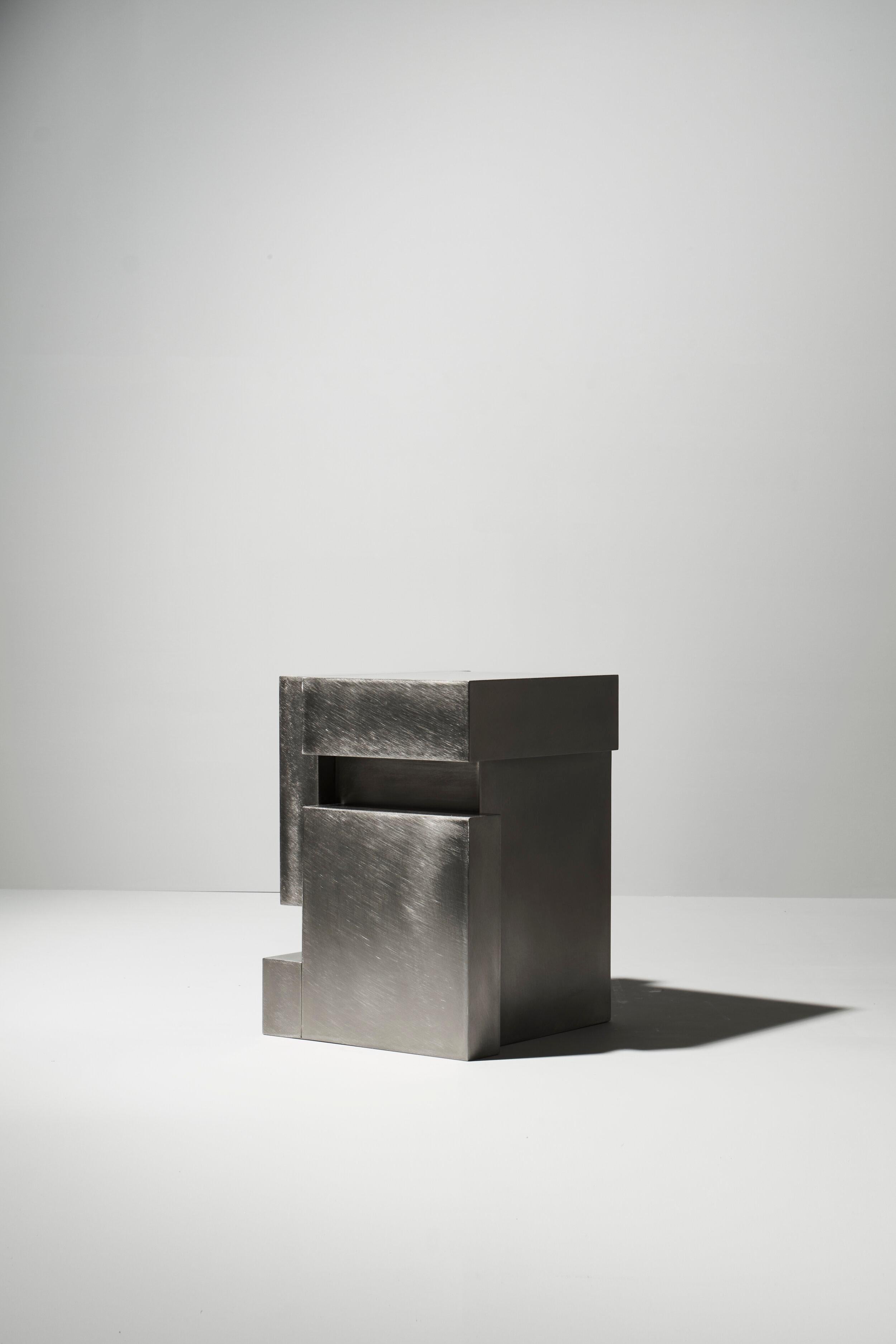 Layered steel seat VIII by Hyungshin Hwang.
Dimensions: D 30 x W 33 x H 42 cm
Materials: stainless steel

Layered Series is the main theme and concept of work of Hwang, who continues his experiment which is based on architectural composition of