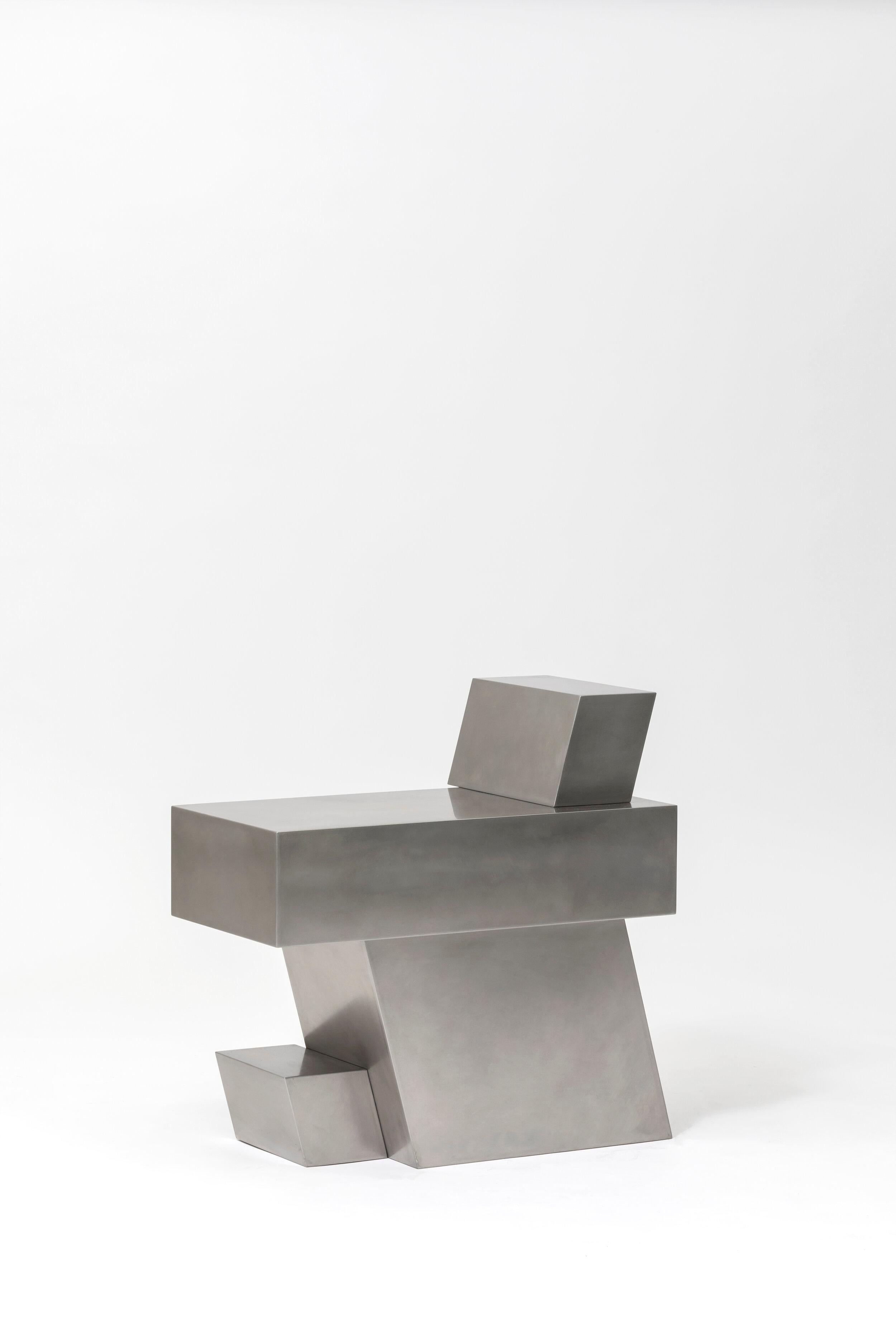 Layered steel seat XVI by Hyungshin Hwang.
Dimensions: D 33 x W 54 x H 54 cm.
Materials: stainless steel.

Layered Series is the main theme and concept of work of Hwang, who continues his experiment which is based on architectural composition of