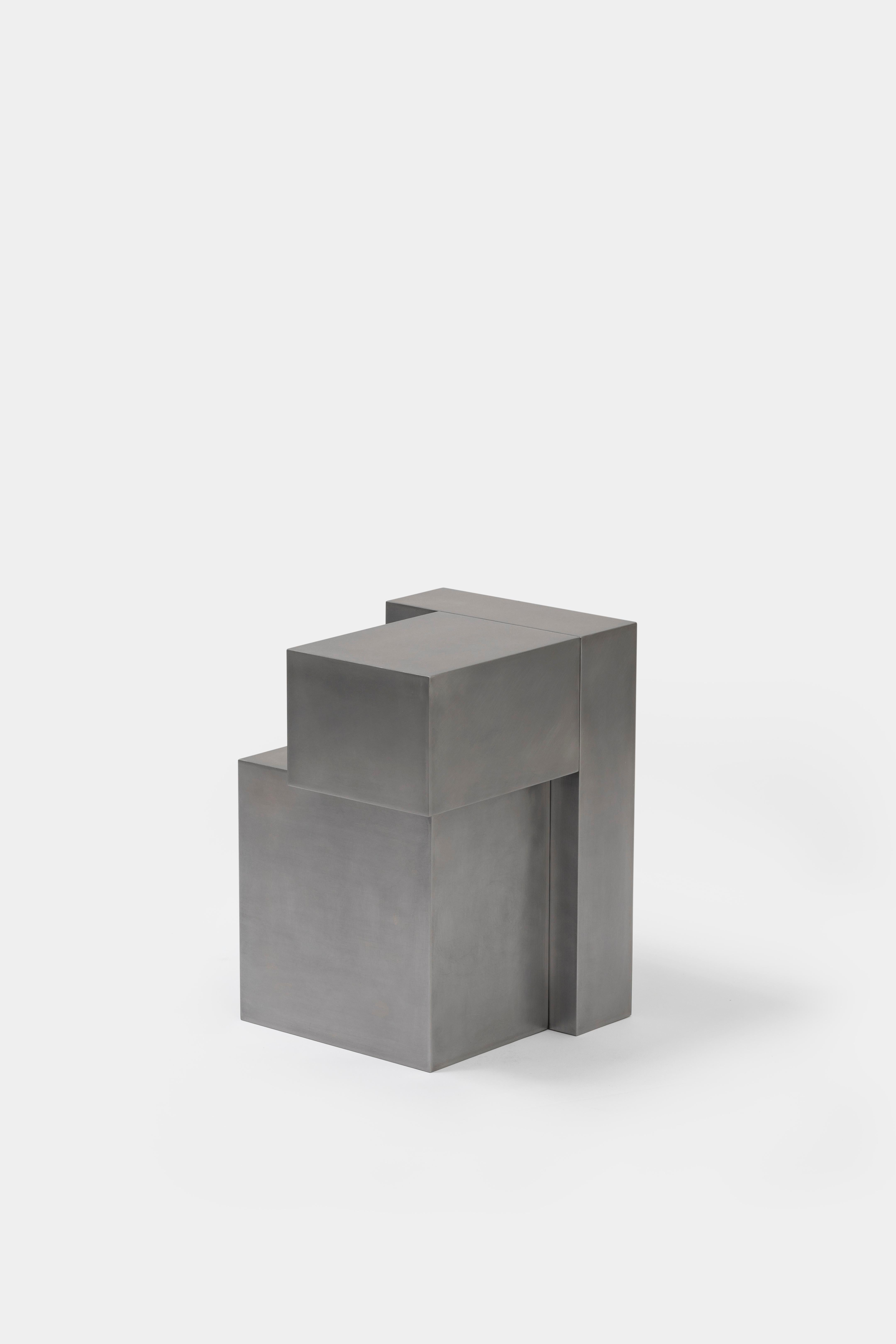Layered steel stool by Hyungshin Hwang.
2019
Dimensions: D 30 x W 30 x H 42 cm.
Materials: stainless steel.

Layered Series is the main theme and concept of work of Hwang, who continues his experiment which is based on architectural composition