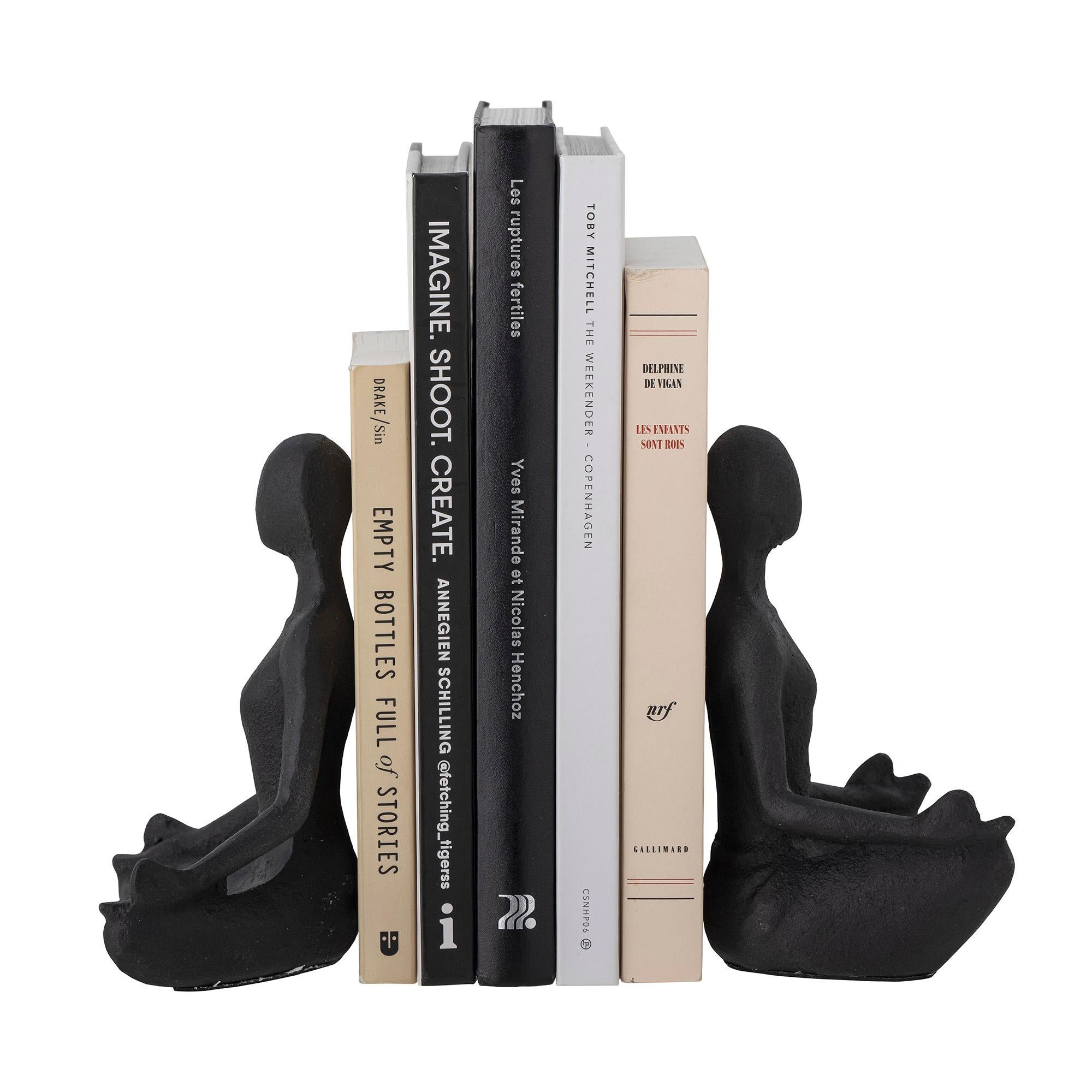 Two sculpture bookend set made of cast iron metal with blackened finish. This beautiful set of 2 sculptures will ensure that your books are perfectly placed and do not tilt. The bookends are made of heavy black metal, where each piece simulates a