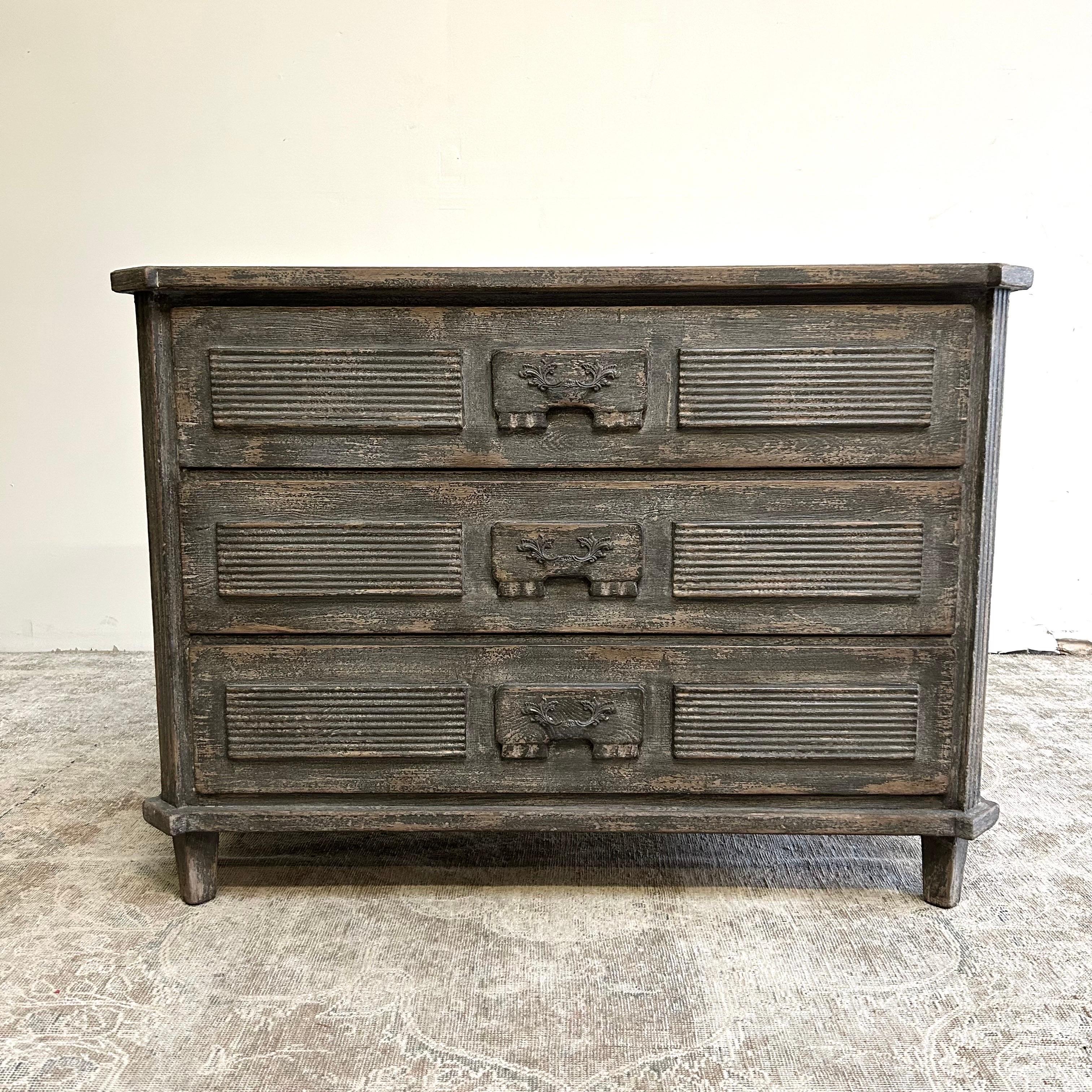 Vintage style painted grey chest of drawers. 
Size: 47” W x 20” D x 34” H
Dovetail finished solid wood drawers, painted in a dark charcoal distressed finish.
Weight 200lbs.

