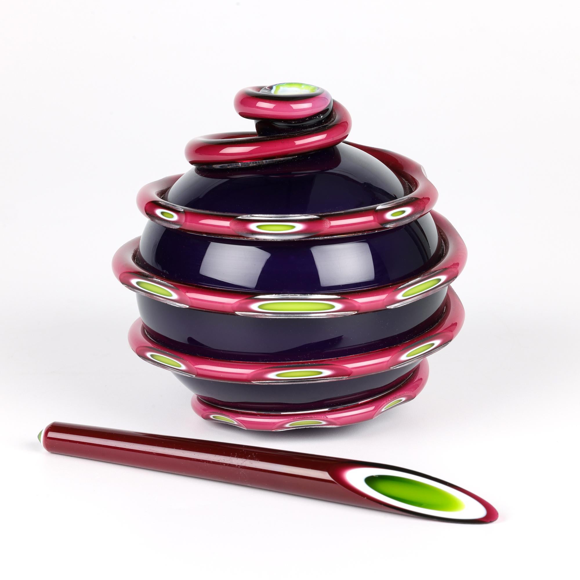 A stunning and unusual modern hand-crafted glass scent bottle and stopper in cased colored glass by Layne Rowe (b. 1971) and probably dating from the latter 20th or early 21st century. The heavily made scent bottle is of rounded form standing on a
