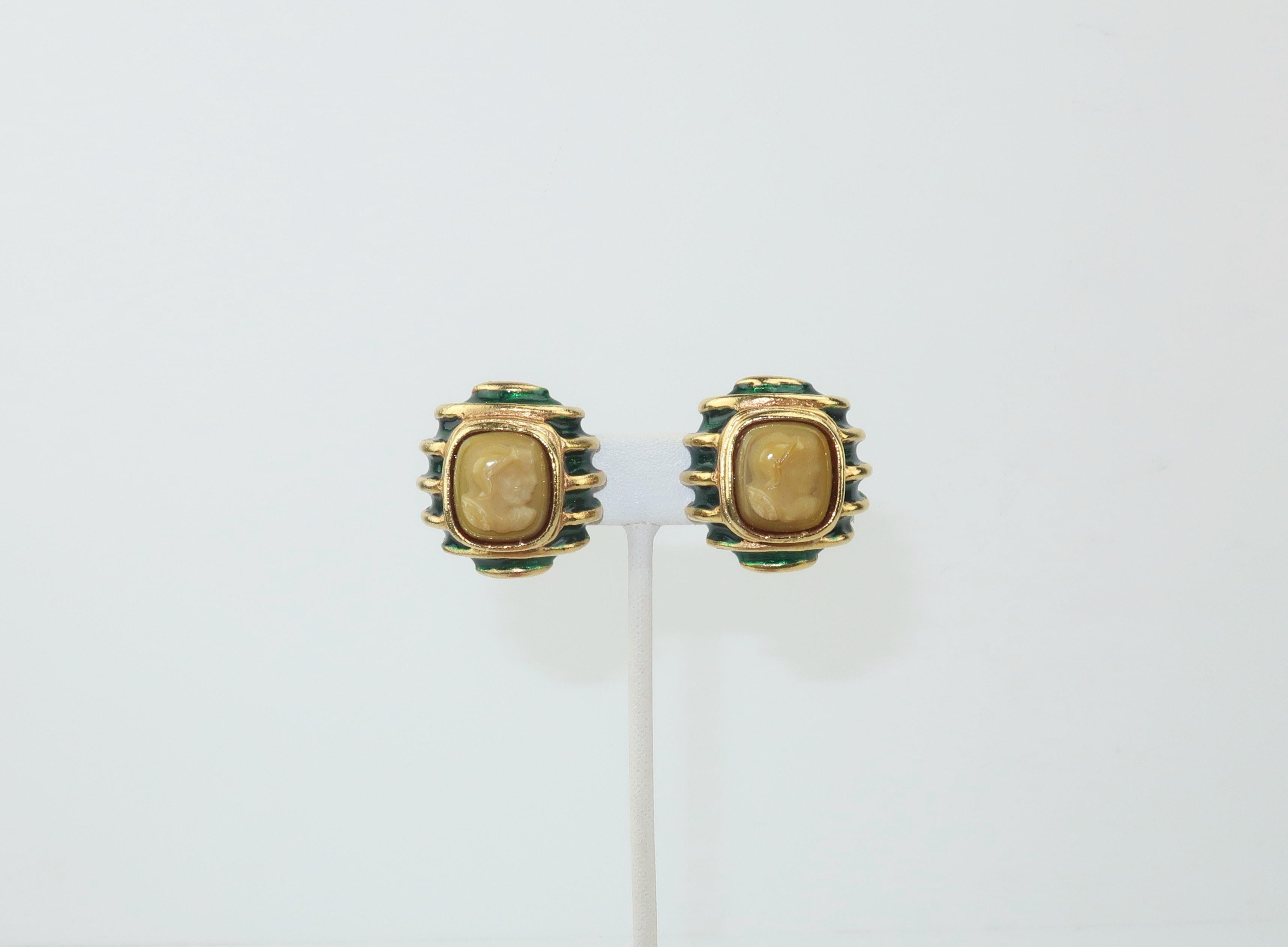 These Lazaro clip on earrings are the perfect blend of modernity and neoclassicism.  A matte gold tone base is accented by an emerald green enamel stripe and a beige glass cameo depicting two Roman soldiers.  Classic elegance!  Very good condition
