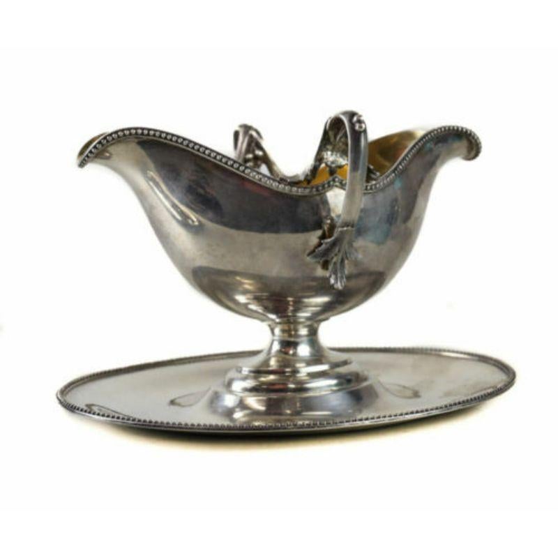 Lazarus Posen German Gilt 800 Silver Gravy Sauce Boat, Early 20th Century

The boat has a beaded rim and kantus leaf accents. Gilt wash interior. Marked to the underside rim. 

Additional information:
Age: Early 20th Century 
Pattern: