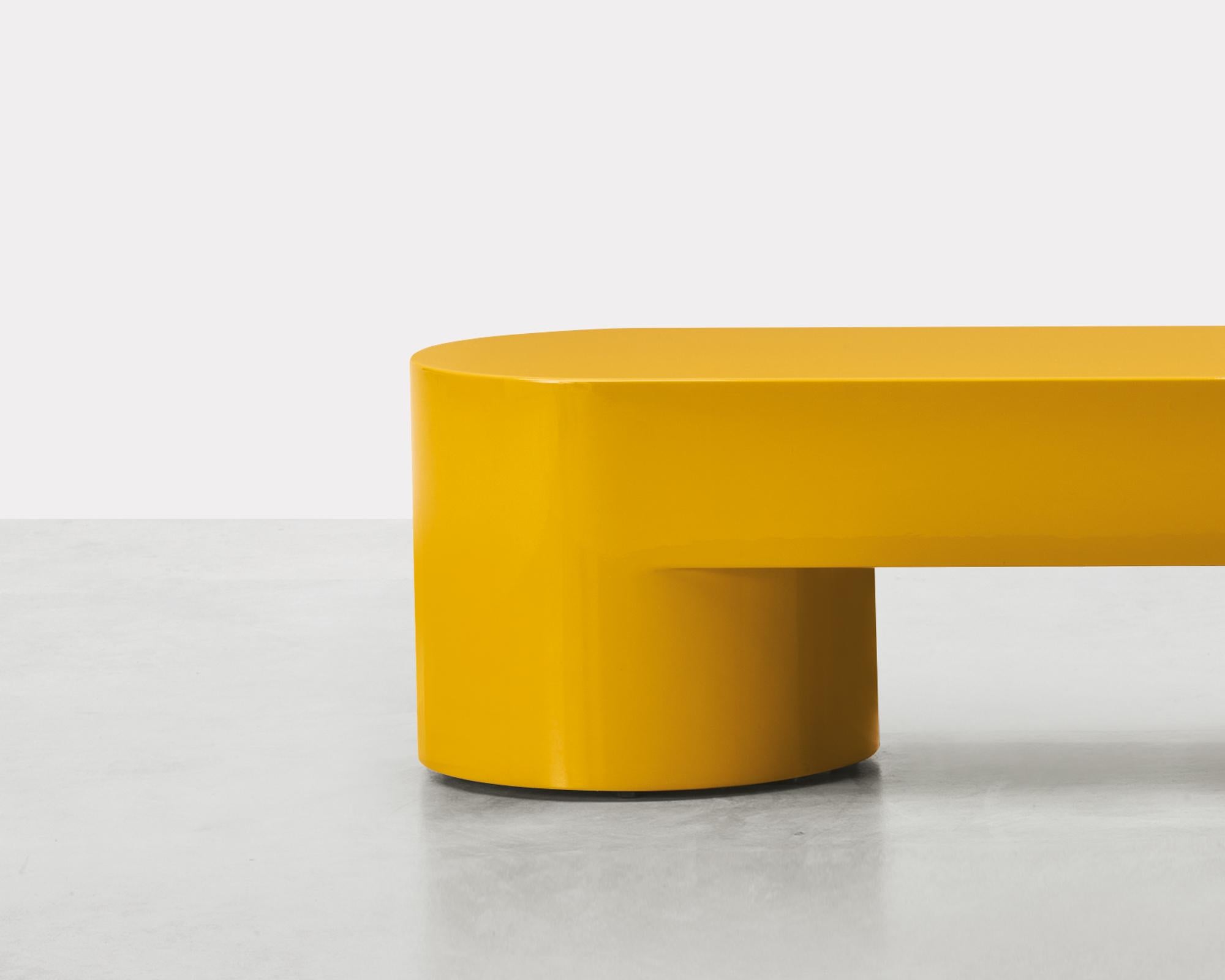 The exaggerated volumes of Lazy-O are the mantra of a series that includes a console table, side tables, and
a bench. The vibrancy of the colors makes the simple, austere forms ironic and playful.
Lightened mdf monolithic structure. Honey yellow