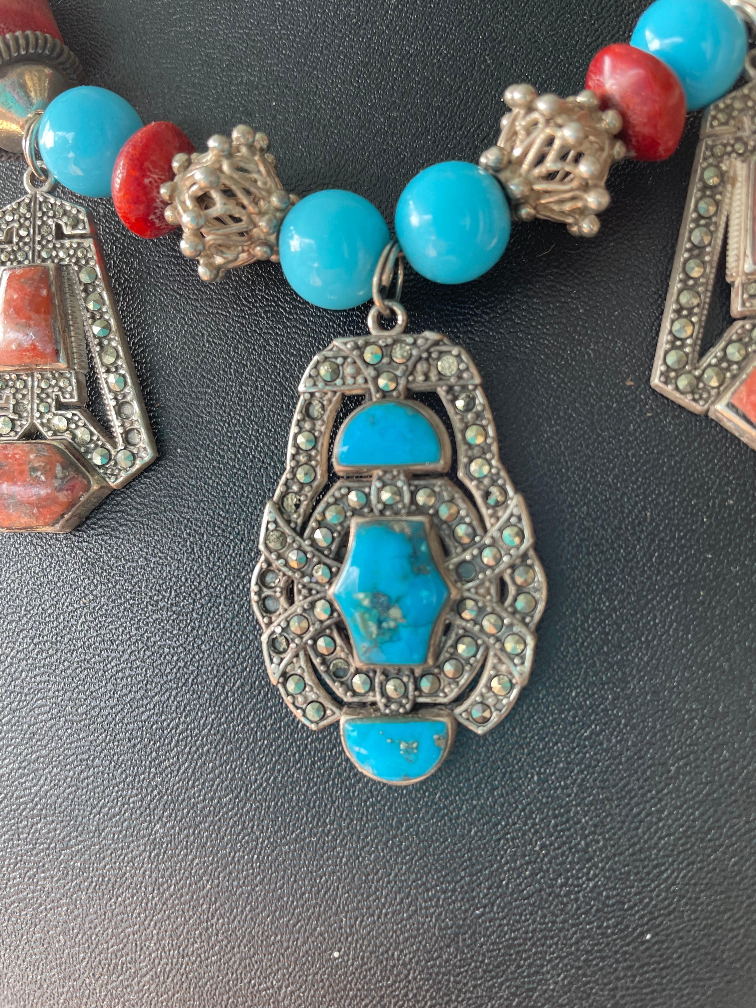 LB offers Art Deco style , triple vintage Mexican sterling , marcasite, coral and turquoise drops , handmade, one of a kind necklace. Vintage glass turquoise beads and Chinese coral ( with sterling silver filigree beads) enhance these highly unusual