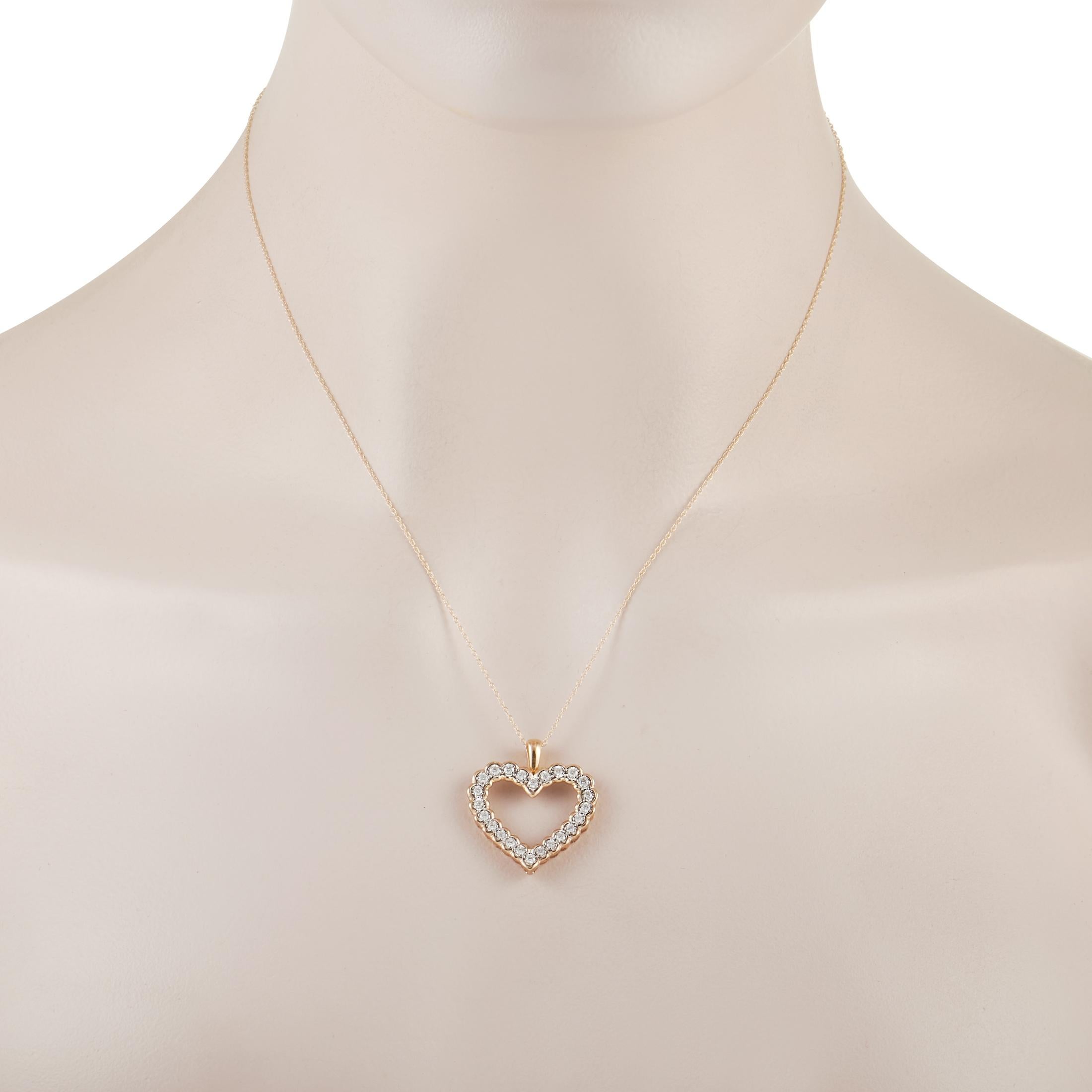 This charming LB Exclusive 10K Yellow Gold 0.50 ct Diamond Heart Pendant Necklace is made with a 10K yellow gold chain and features a matching yellow gold heart pendant set with 0.50 carats of round diamonds around the pendant. The delicate 10K