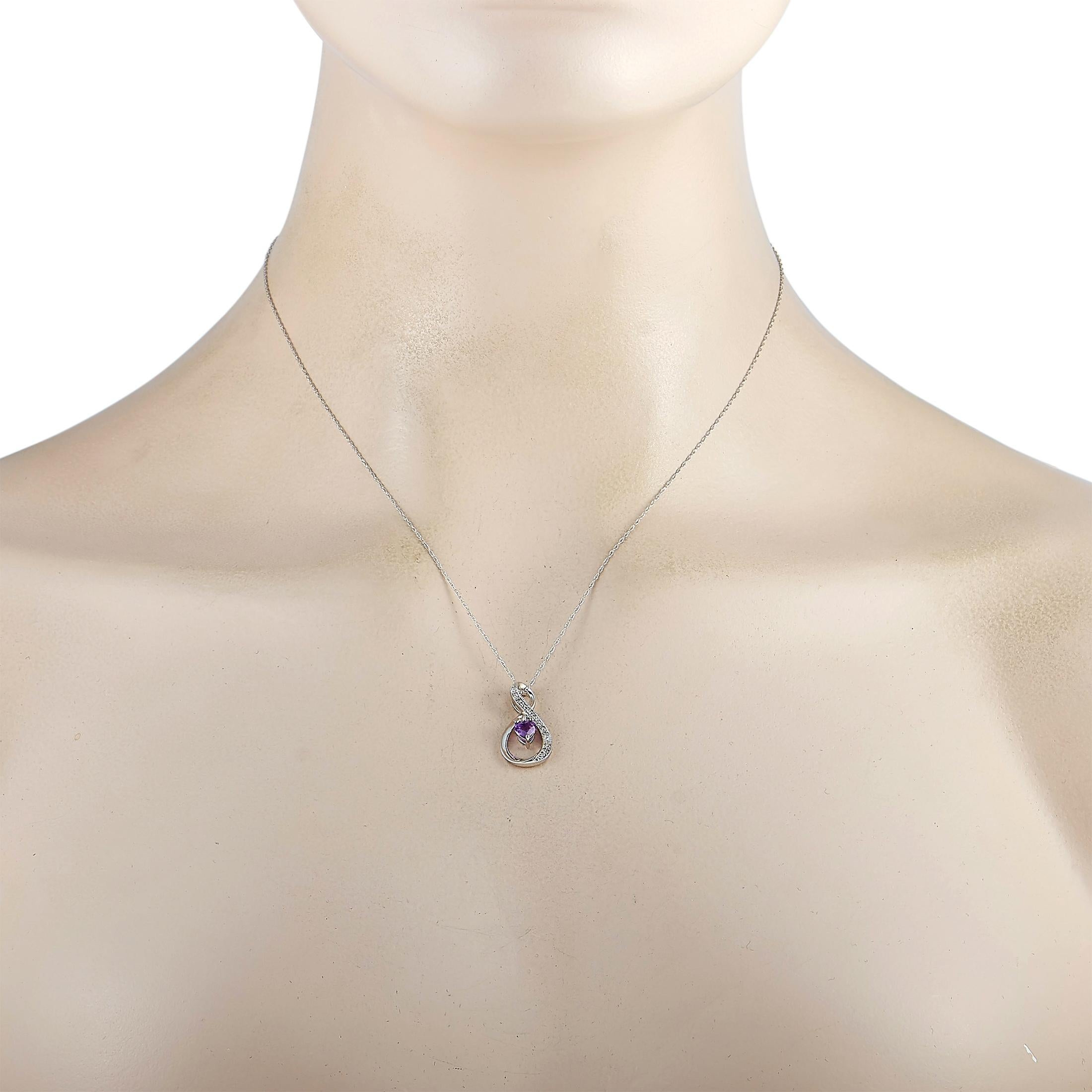 This LB Exclusive necklace is crafted from 14K white gold and weighs 2.6 grams. It is presented with an 18” chain and a pendant that measures 0.87” in length and 0.47” in width. The necklace is embellished with an amethyst and a total of 0.03 carats