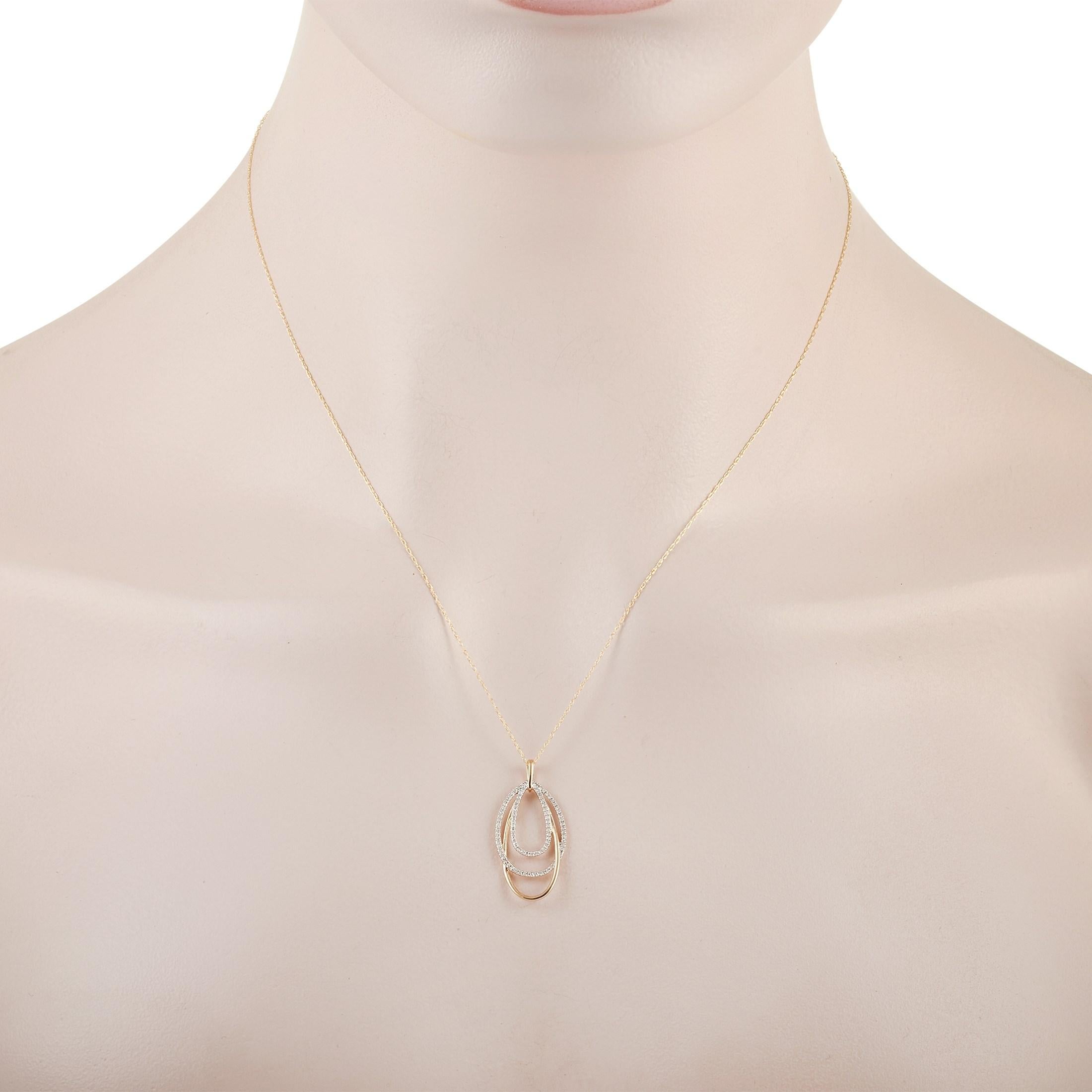 The LB Exclusive 14K Yellow Gold 0.17 ct Diamond Layered Oval Pendant Necklace features a delicate 14K Yellow Gold chain that is 17 inches in length and includes a yellow gold triple oval pendant set with 0.17 carats of round cut diamonds. The
