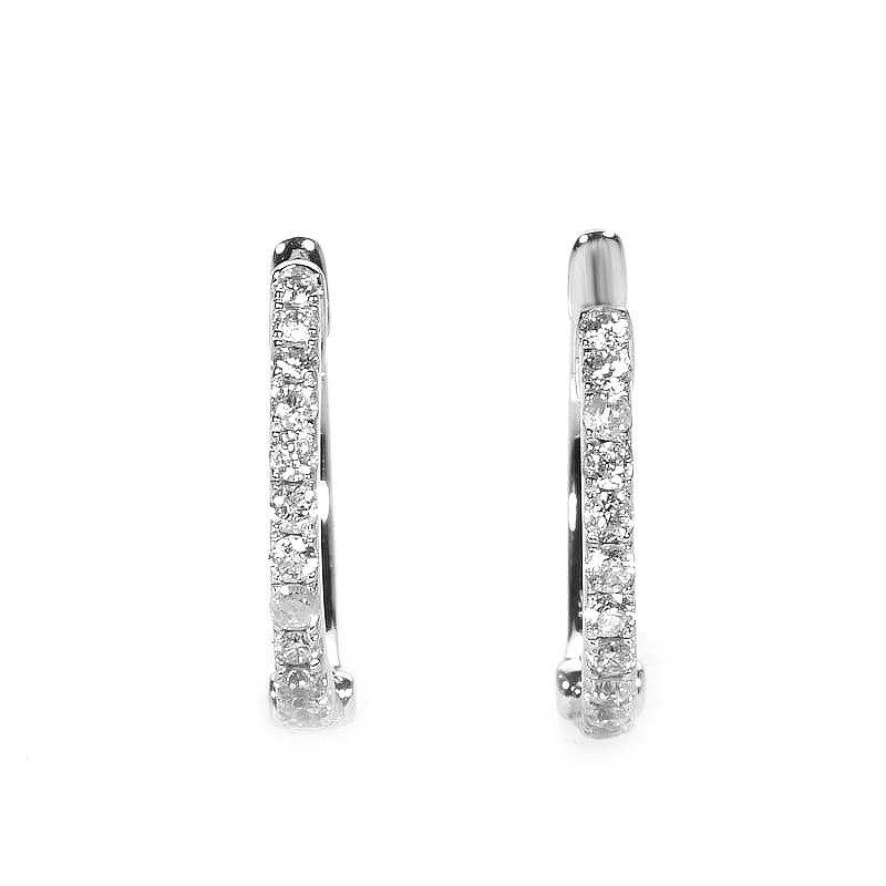 The beauty of a pair of hoop earrings transcends time. This particular pair of hoop earrings is made of 14K white gold and are set with ~.31ct of diamonds.


