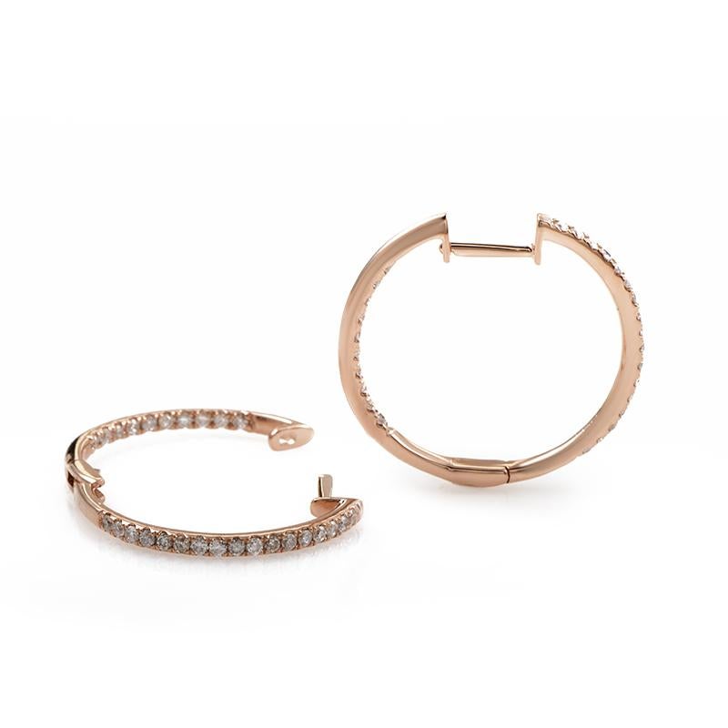 This harmoniously designed pair of hoop earrings is made of lovely warm-toned 14K rose gold and set with 0.51ct of sparkly diamonds.
