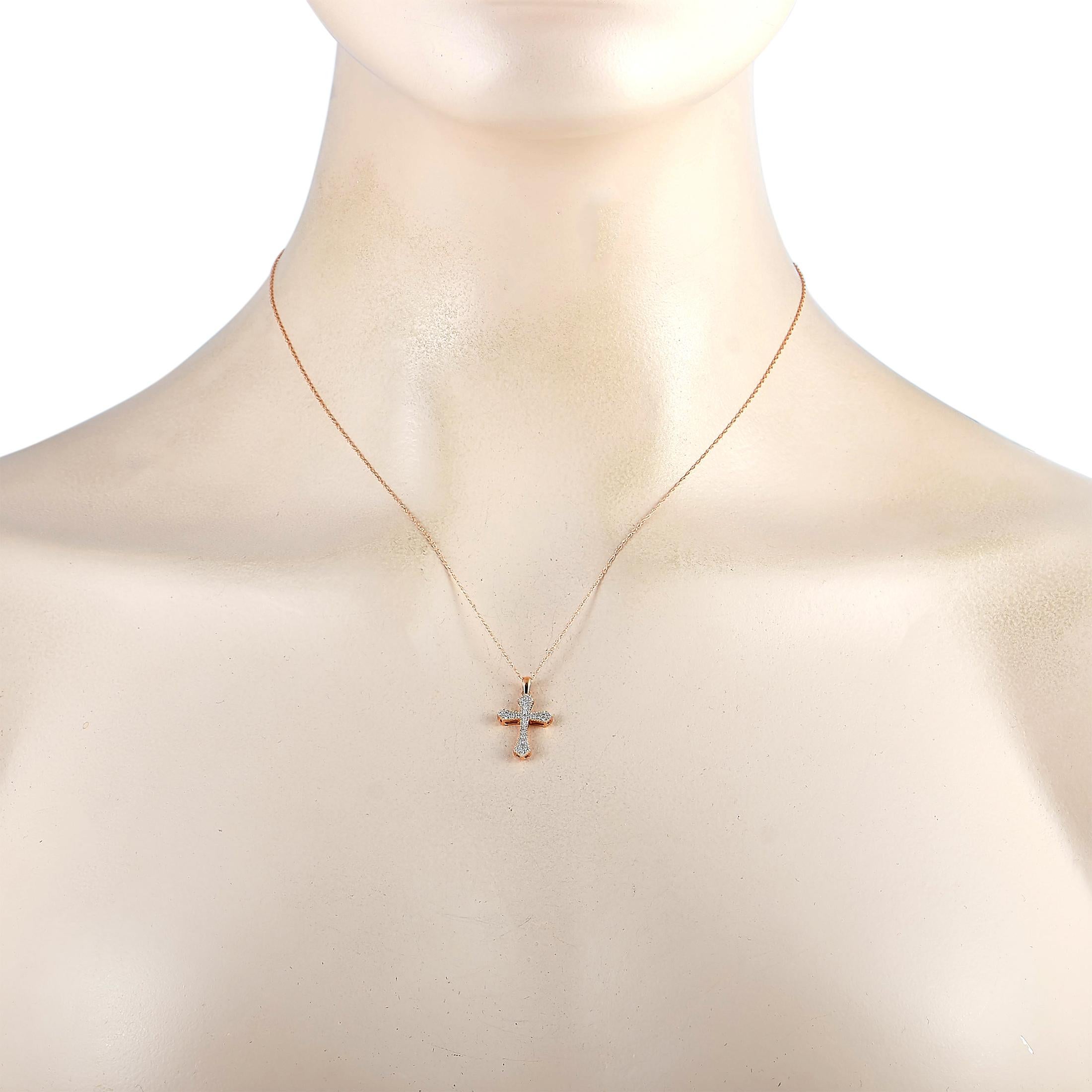 This LB Exclusive necklace is crafted from 14K rose gold and weighs 1.2 grams. It is presented with an 18” chain and a cross pendant that measures 0.87” in length and 0.50” in width. The necklace is embellished with diamonds that total 0.10