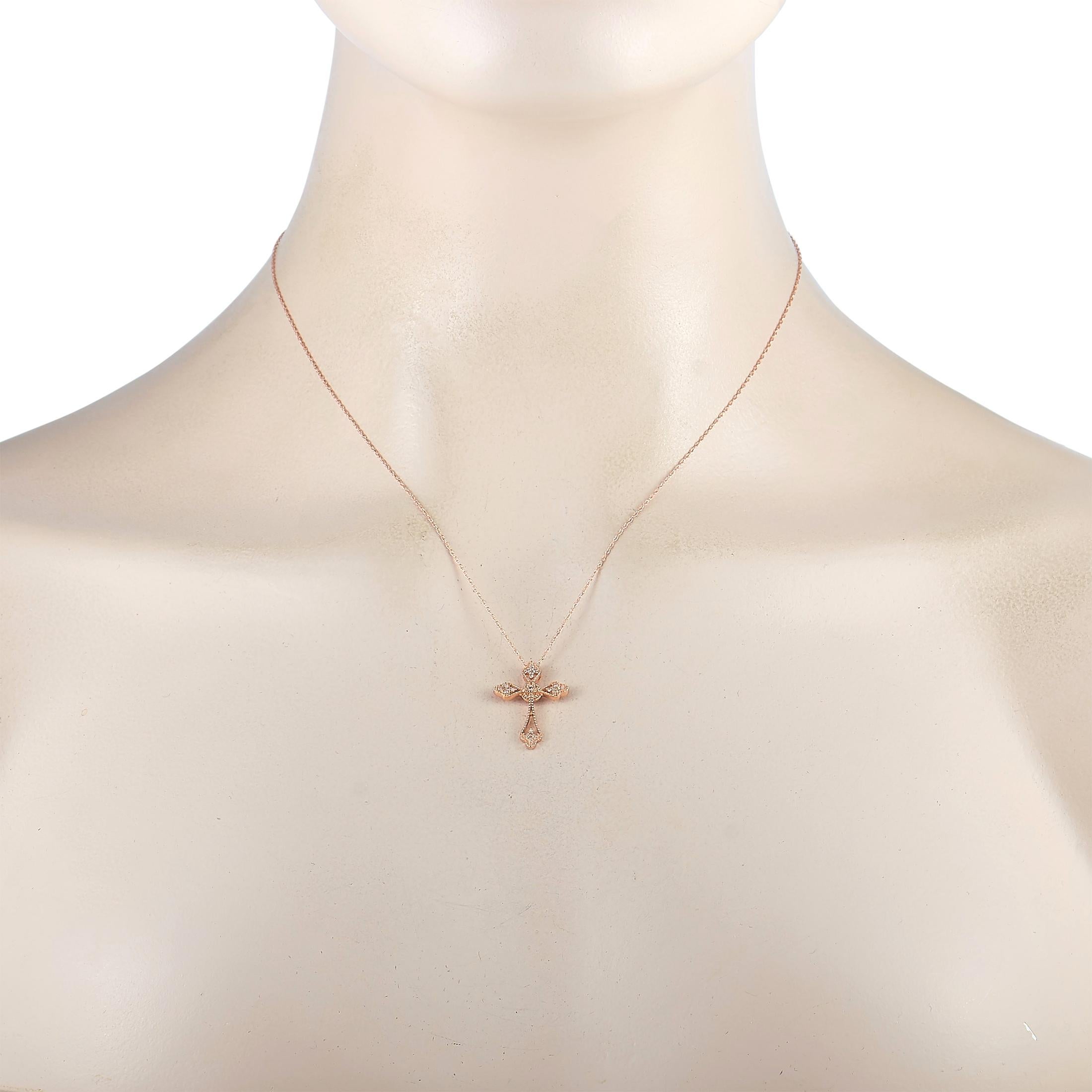 This LB Exclusive necklace is made of 14K rose gold and embellished with diamonds that amount to 0.10 carats. The necklace weighs 1.5 grams and is presented with a 17” chain and a cross pendant that measures 0.87” in length and 0.62” in