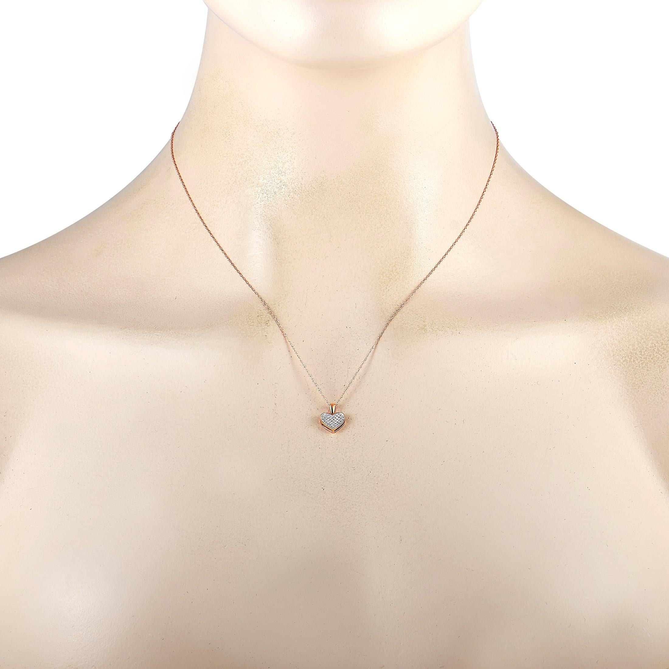 This LB Exclusive necklace is crafted from 14K rose gold and weighs 1.17 grams. It is presented with a 17” chain and a heart pendant that measures 0.49” in length and 0.37” in width. The necklace is embellished with diamonds that total 0.11