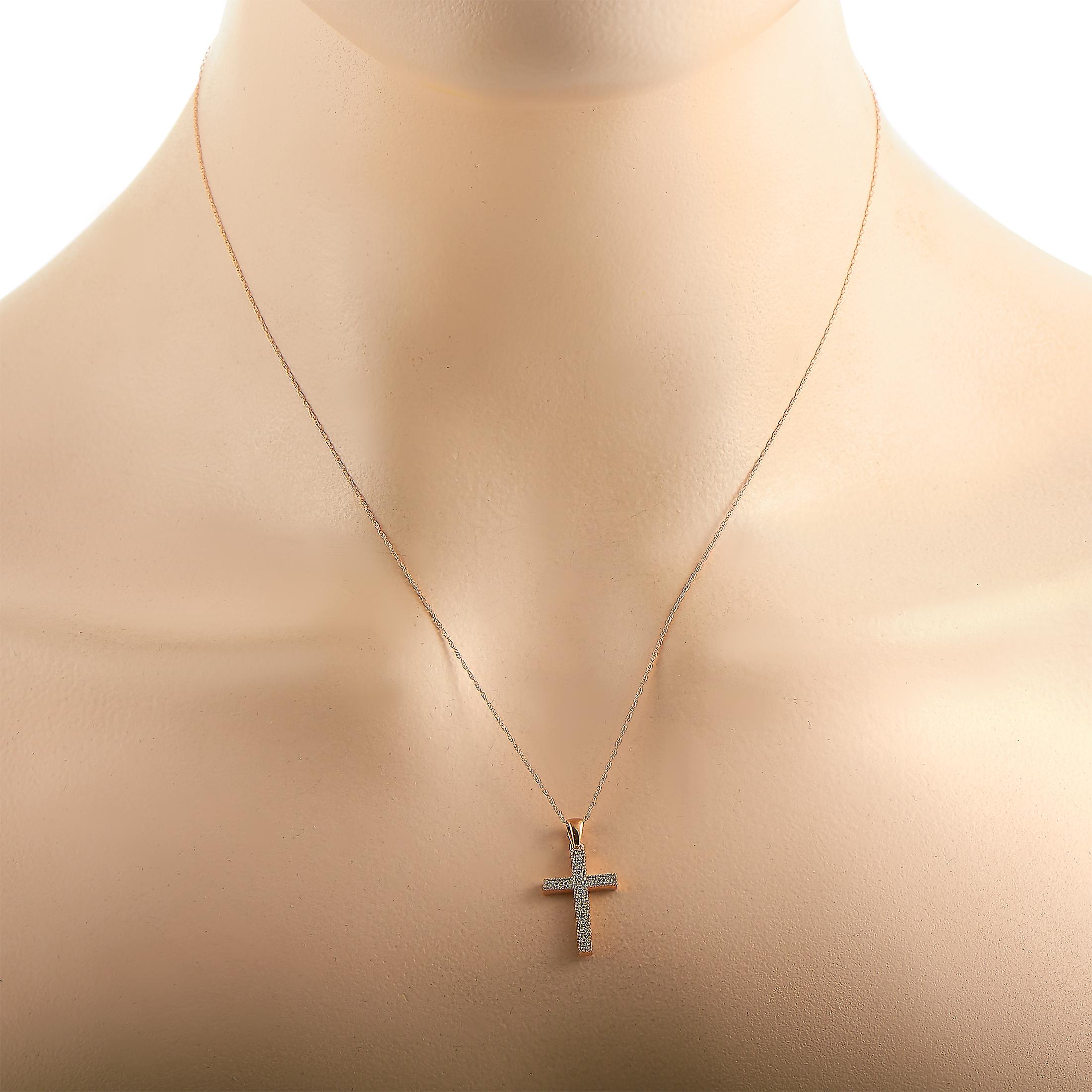 This LB Exclusive necklace is crafted from 14K rose gold and weighs 1.7 grams. It is presented with an 18” chain and a cross pendant that measures 1” in length and 0.55” in width. The necklace is embellished with diamonds that total 0.16