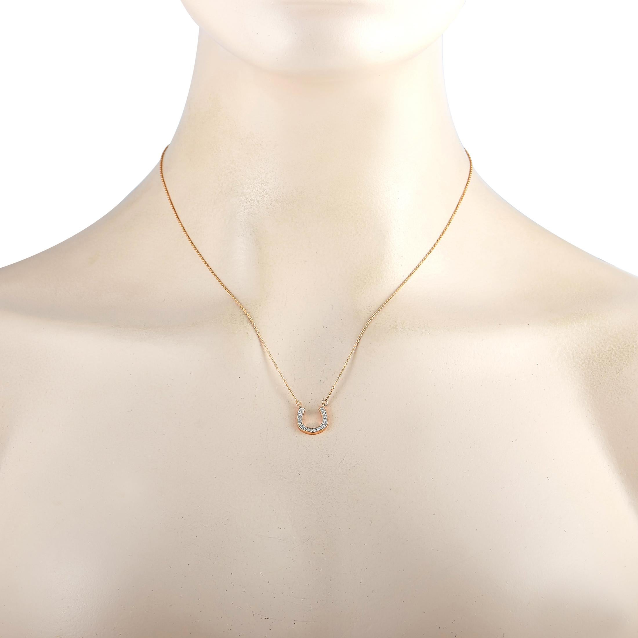 This LB Exclusive necklace is made of 14K rose gold and embellished with diamonds that amount to 0.19 carats. The necklace weighs 2.4 grams and is presented with a 17” chain and a horseshoe pendant that measures 0.50” in length and 0.47” in