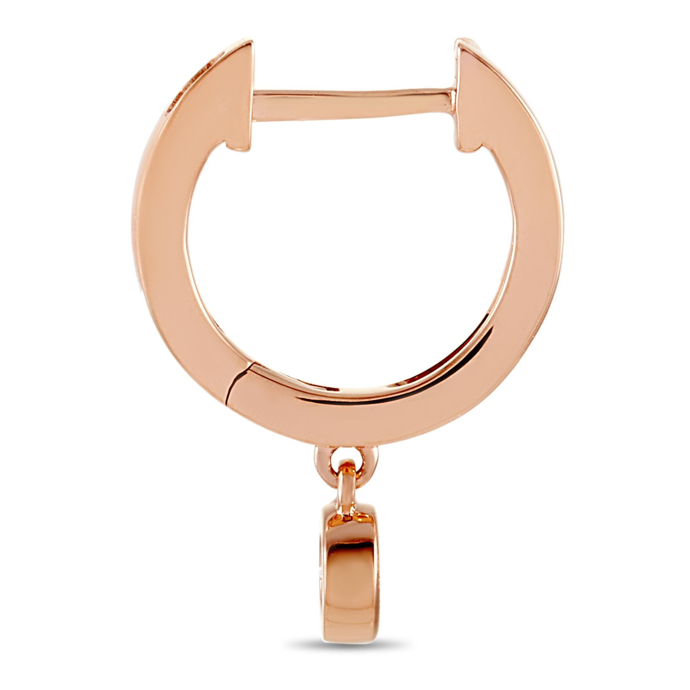 These LB Exclusive earrings are crafted from 14K rose gold and each of the two weighs 0.8 grams. They measure 0.63” in length and 0.07” in width. The pair is set with diamonds that total 0.20 carats.
 
 The earrings are offered in brand new