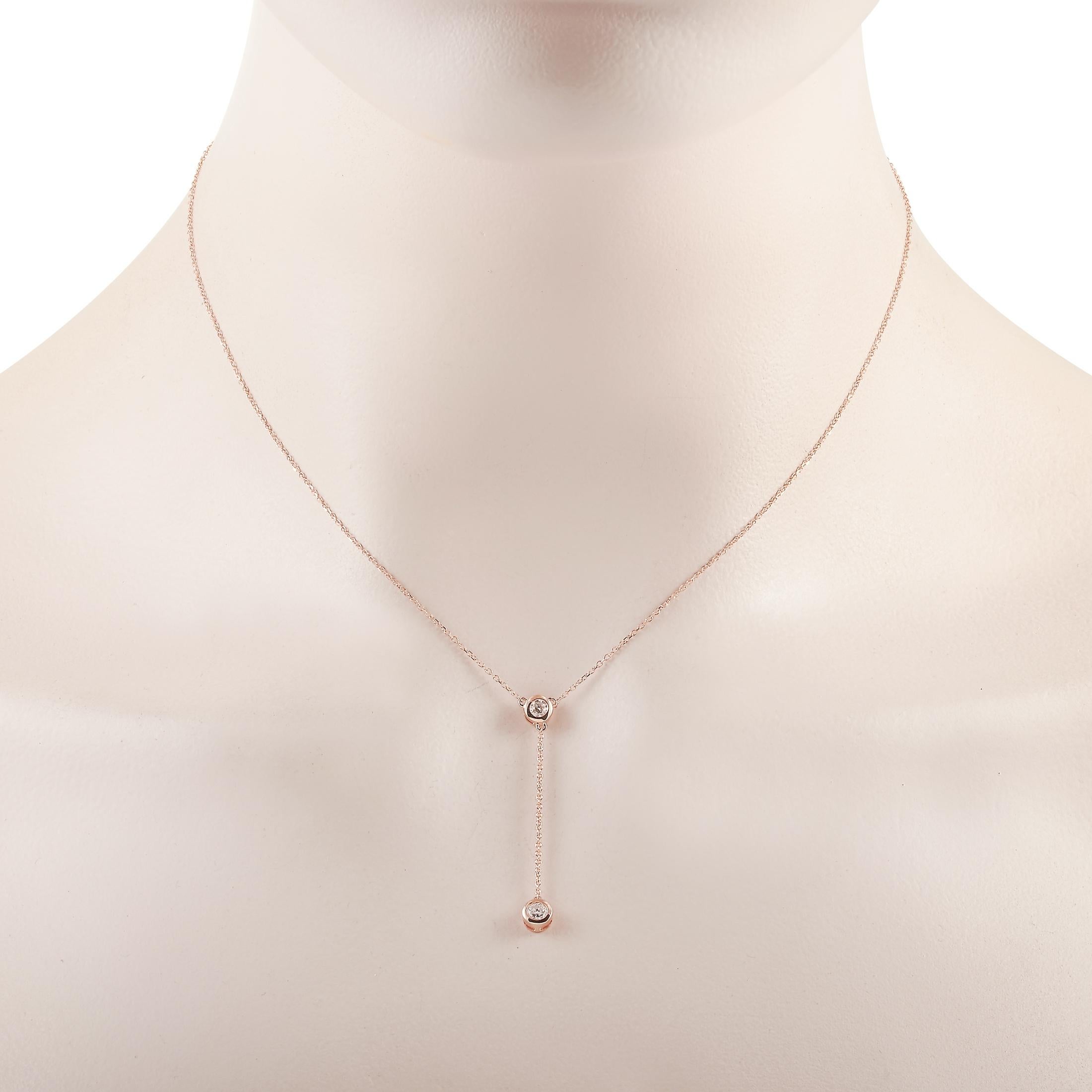 This LB Exclusive necklace is made of 14K rose gold and embellished with diamonds that total 0.20 carats. The necklace weighs 1.7 grams and boasts a 15” chain and a pendant that measures 1.50” in length and 0.13” in width.
 
 Offered in brand new