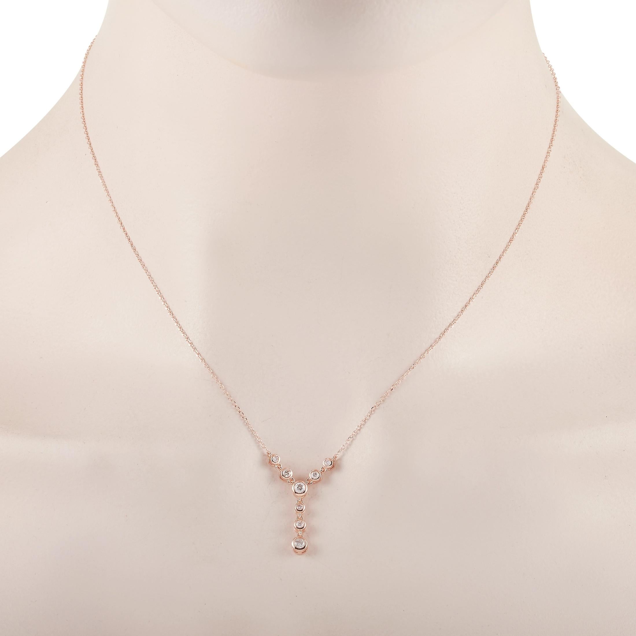 This LB Exclusive necklace is crafted from 14K rose gold and weighs 2.3 grams. It is presented with a 15” chain and boasts a pendant that measures 1” in length and 0.50” in width. The necklace is set with diamonds that total 0.25 carats.
 
 Offered