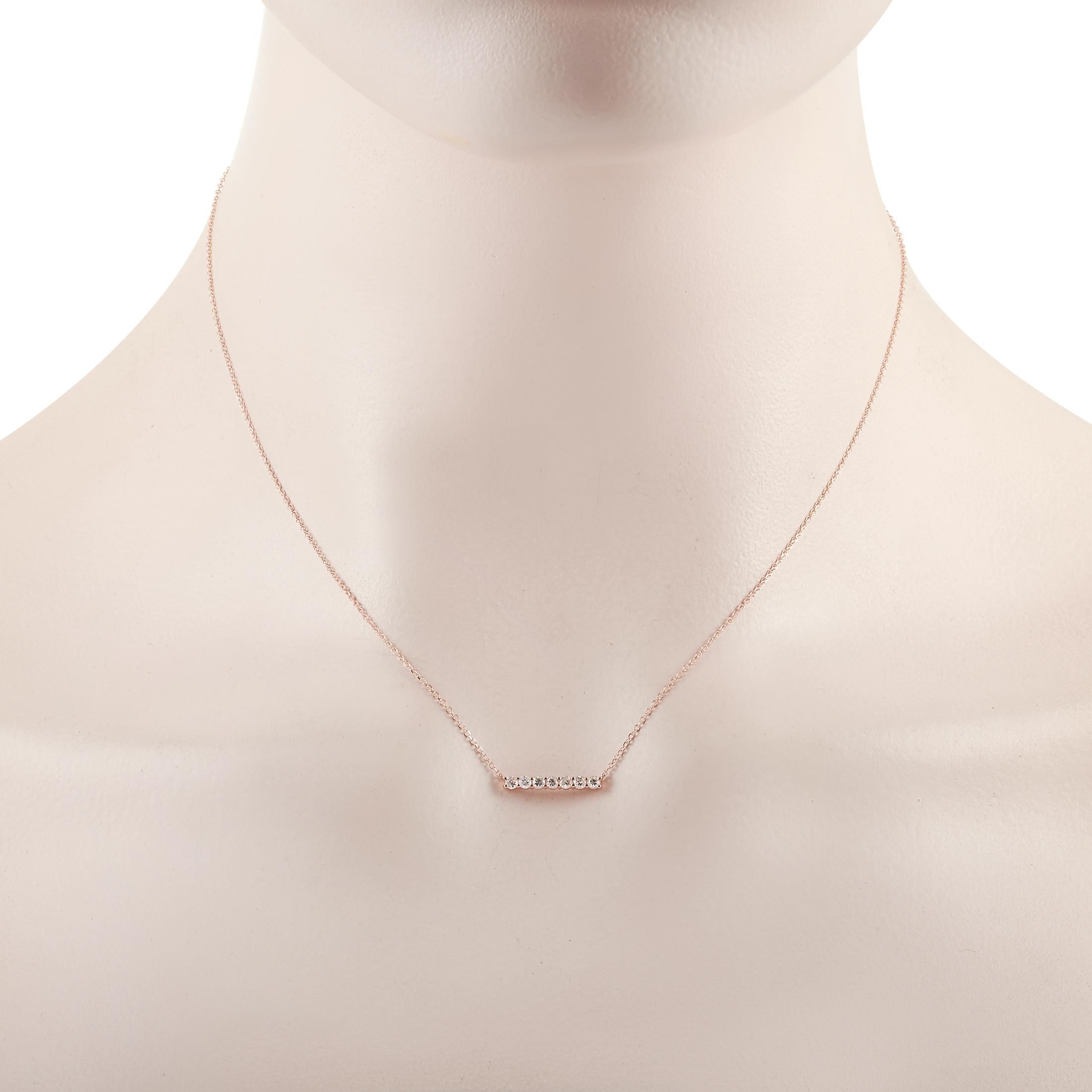 This LB Exclusive necklace is crafted from 14K rose gold and weighs 1.4 grams. It is presented with a 15” chain and boasts a pendant that measures 0.13” in length and 0.50” in width. The necklace is set with diamonds that total 0.25 carats.
 
