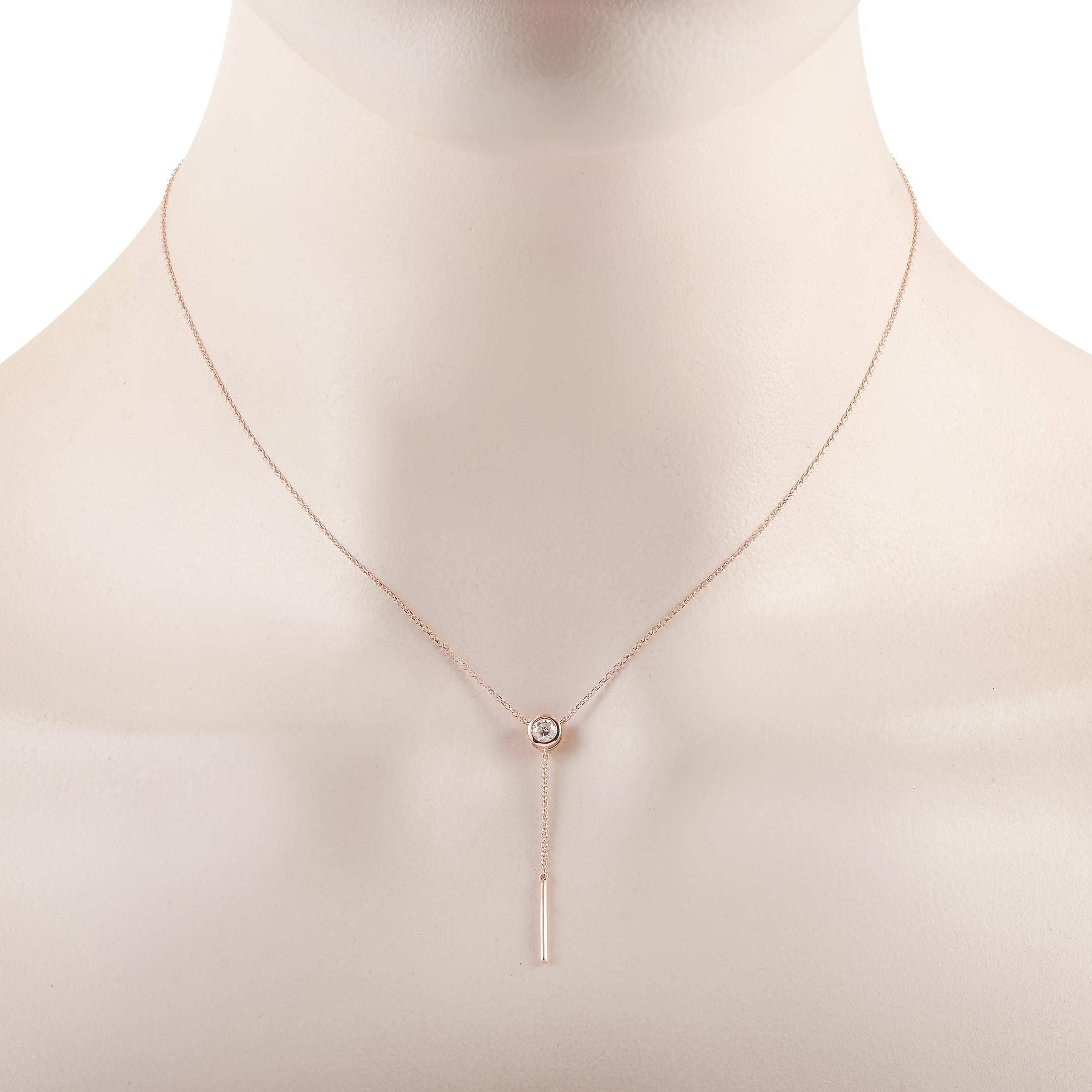 This LB Exclusive necklace is made of 14K rose gold and embellished with a 0.25 ct diamond stone. The necklace weighs 1.7 grams and boasts a 15” chain and a pendant that measures 1.50” in length and 0.13” in width.
 
 Offered in brand new condition,