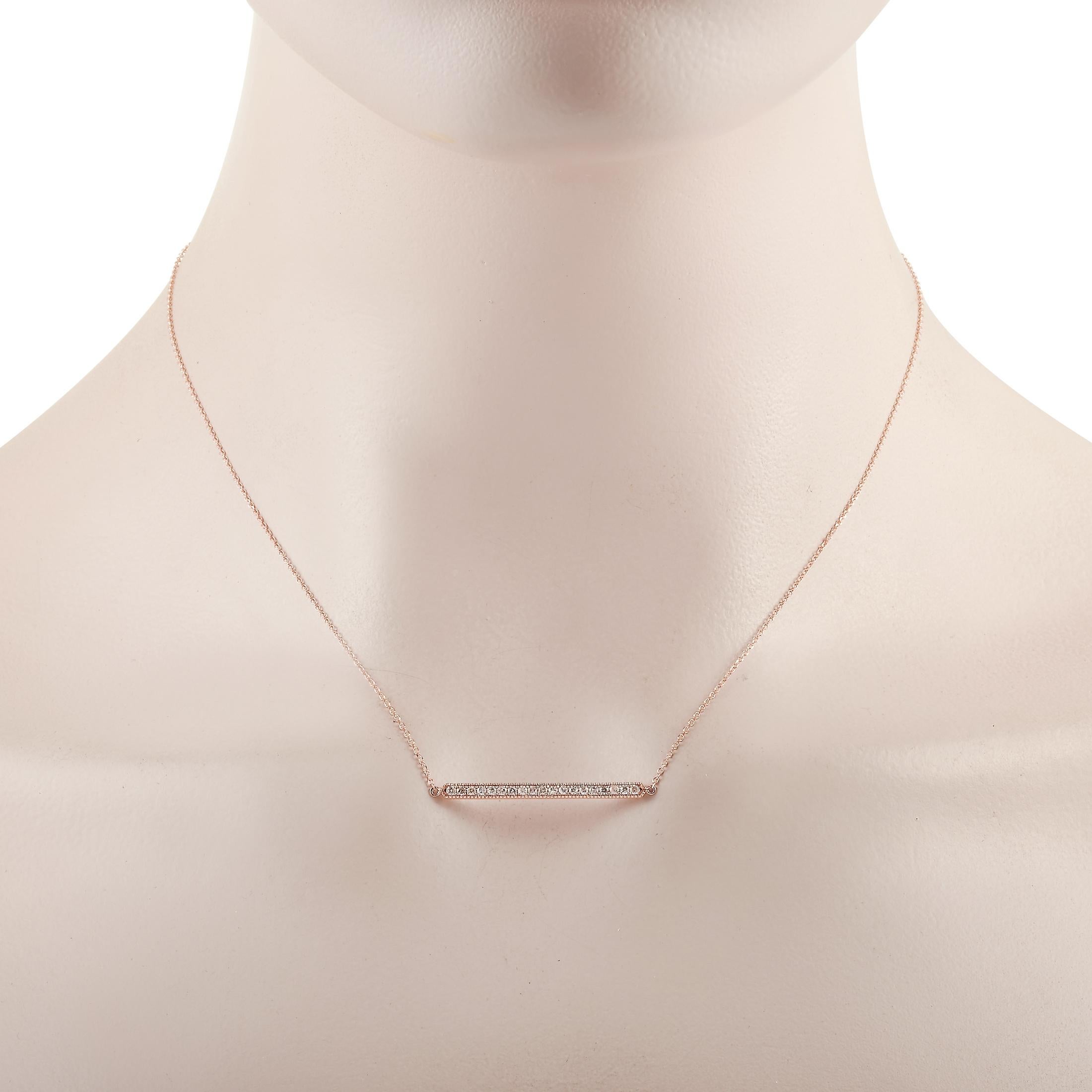 This LB Exclusive necklace is crafted from 14K rose gold and weighs 1.9 grams. It is presented with a 15” chain and boasts a pendant that measures 0.13” in length and 1.25” in width. The necklace is set with diamonds that total 0.25 carats.
 
