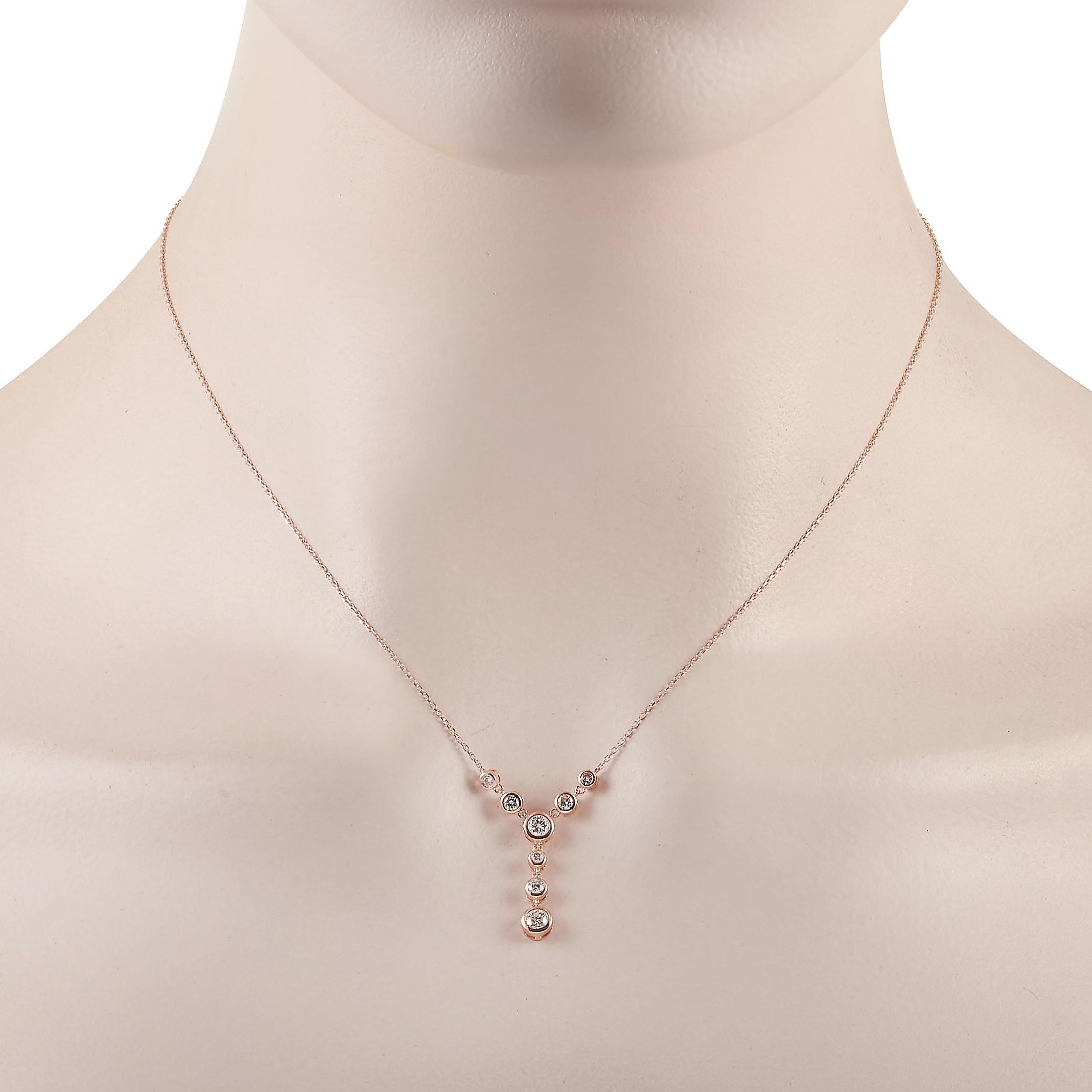 This LB Exclusive necklace is crafted from 14K rose gold and weighs 2.7 grams. It is presented with a 15” chain and boasts a pendant that measures 1” in length and 0.50” in width. The necklace is set with diamonds that total 0.50 carats.
 
 Offered