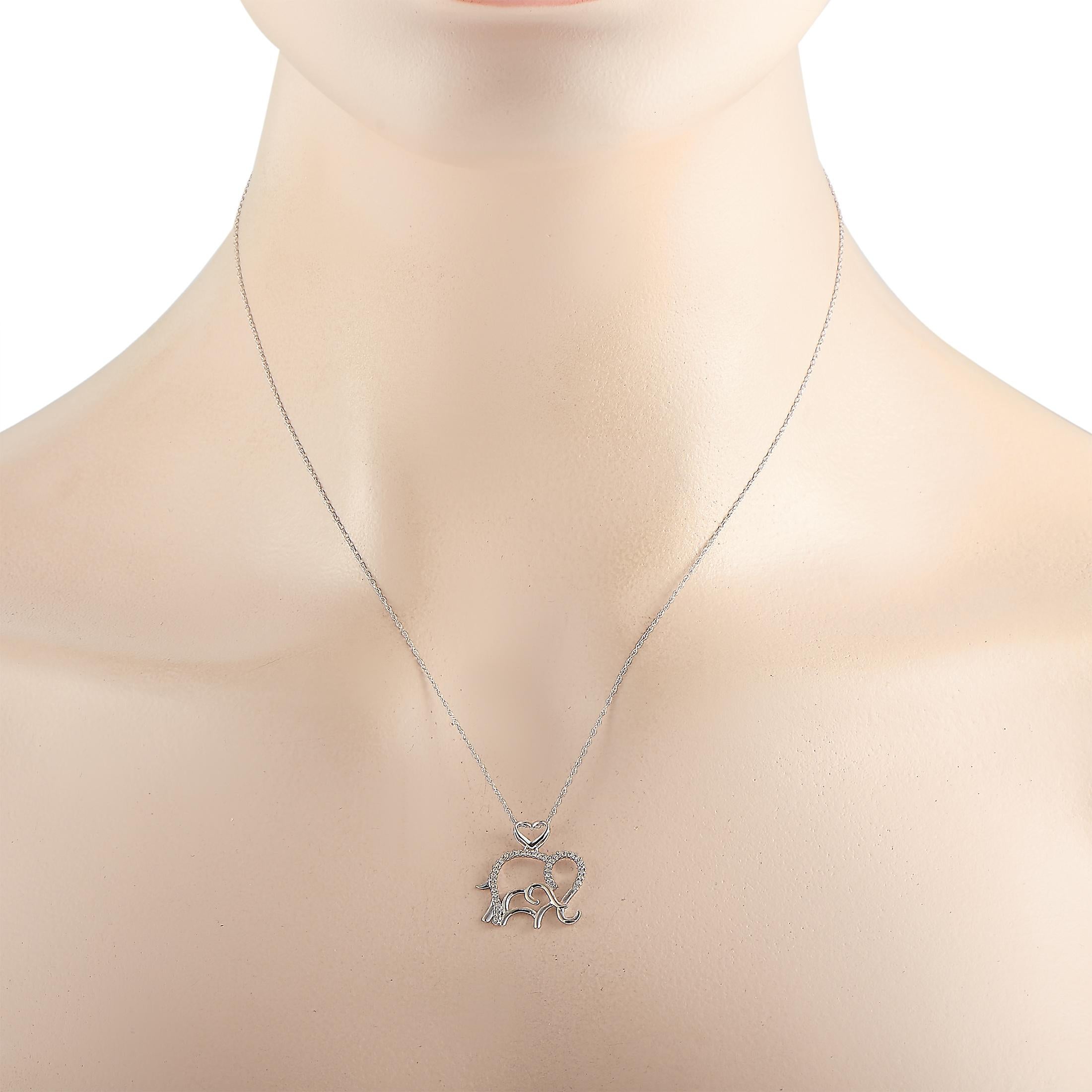 This LB Exclusive necklace is made of 14K white gold and embellished with diamonds that amount to 0.10 carats. The necklace weighs 1.6 grams and boasts a 17” chain and an elephant pendant that measures 0.75” in length and 0.88” in width.
 
 Offered