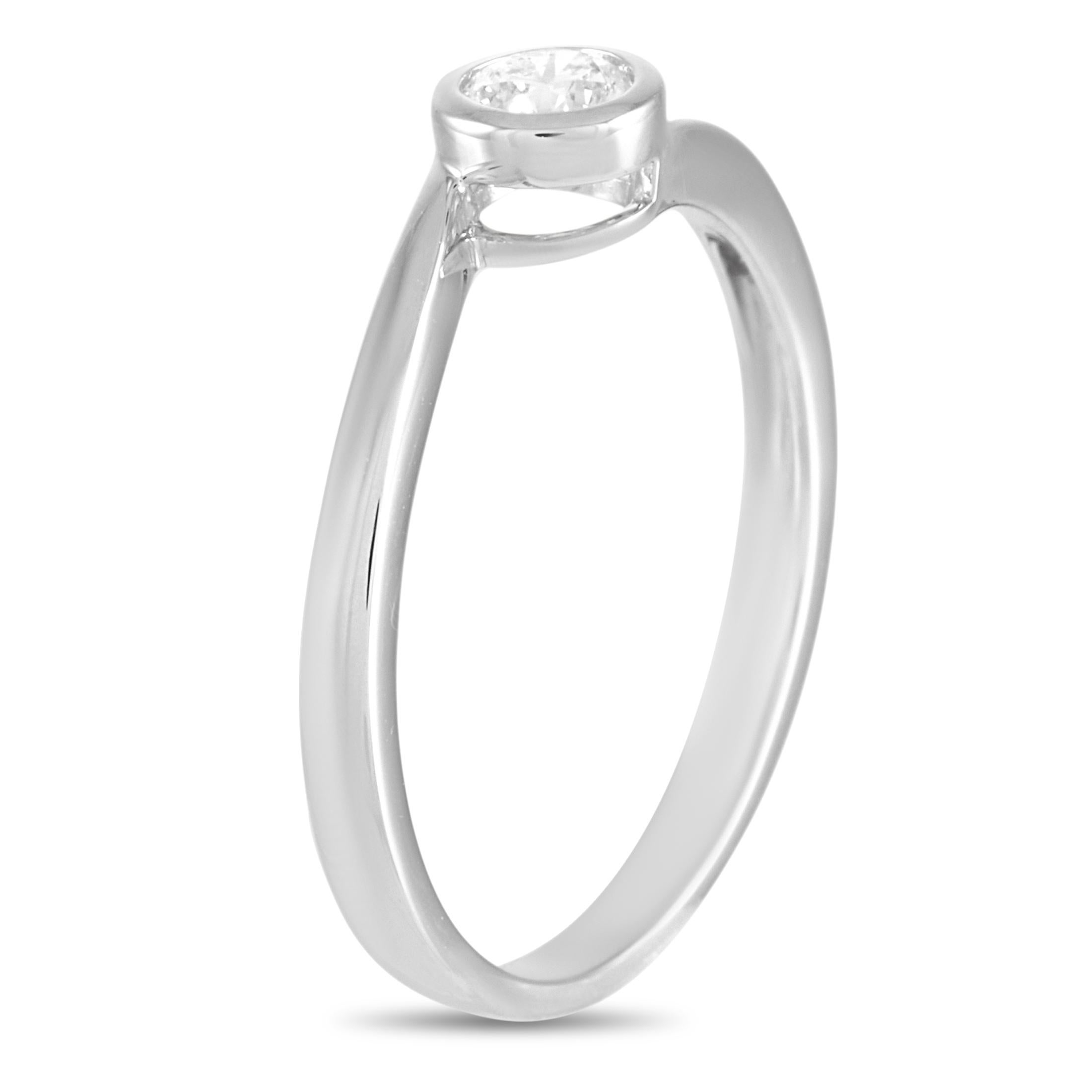 This LB Exclusive ring is crafted from 14K white gold and weighs 1.7 grams. It boasts band thickness of 2 mm and top height of 4 mm, while top dimensions measure 4 by 4 mm. The ring is set with a 0.22 ct diamond stone.
 
 Offered in brand new