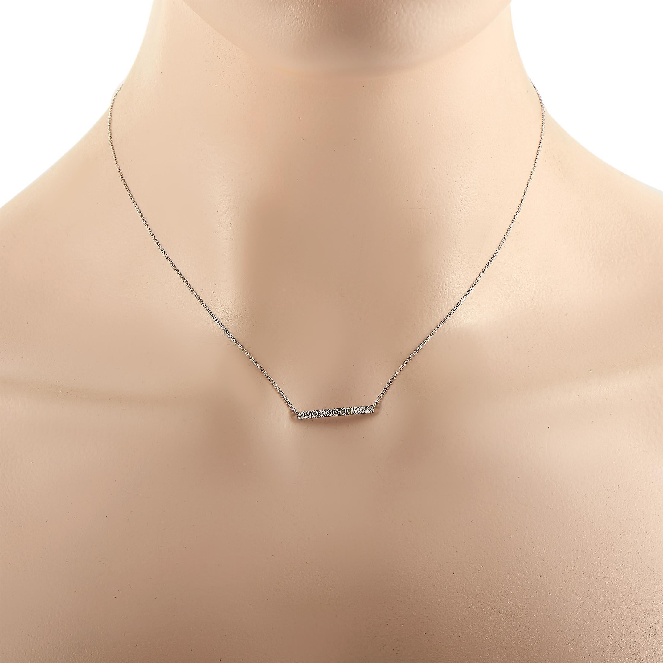 This LB Exclusive necklace is made of 14K white gold and embellished with diamonds that amount to 0.25 carats. The necklace weighs 2 grams and boasts a 16” chain and a pendant that measures 0.15” in length and 0.75” in width.
 
 Offered in brand new